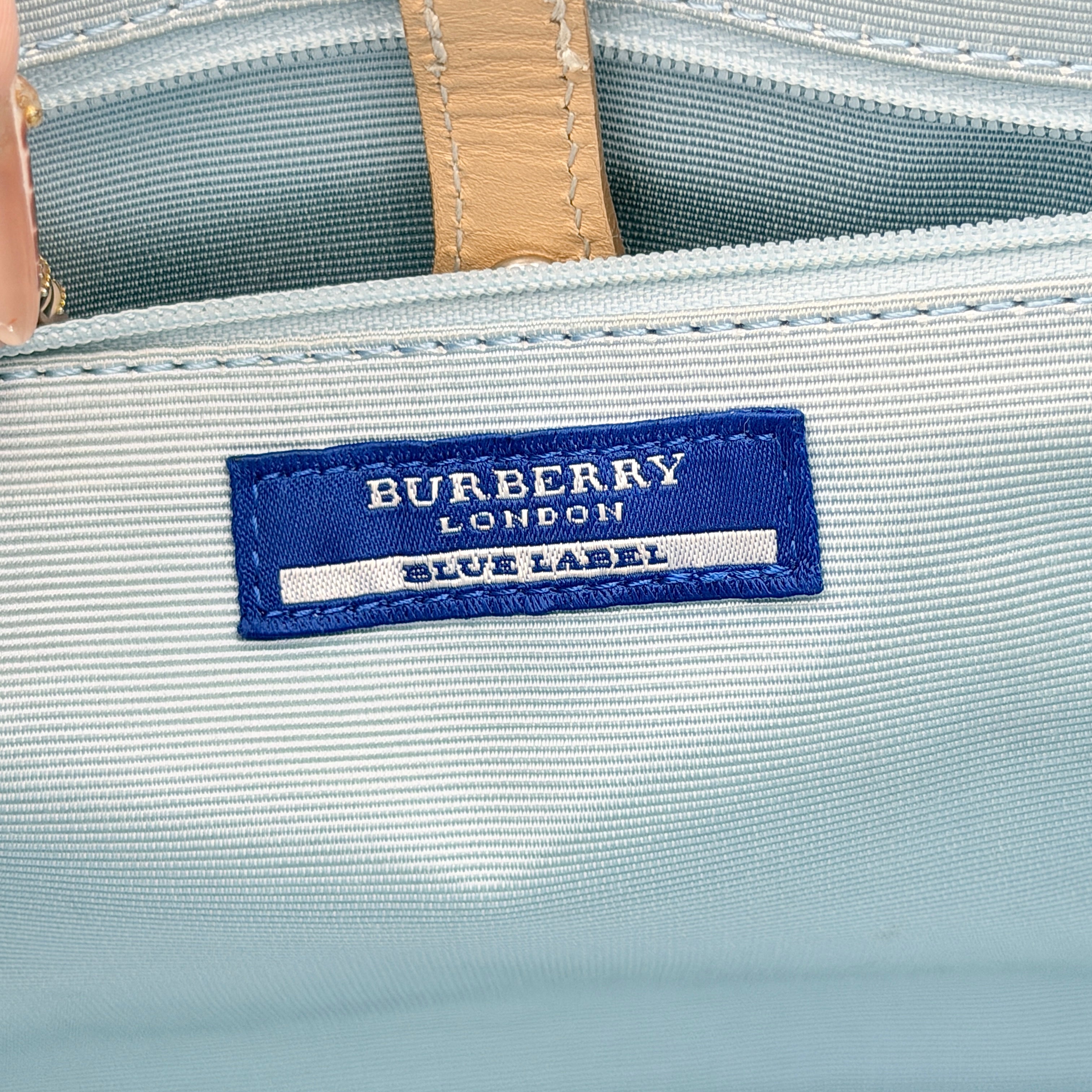 Burberry Blue Label Nova Check handbag in beige with leather trim and double top handles, displayed against a white background.
