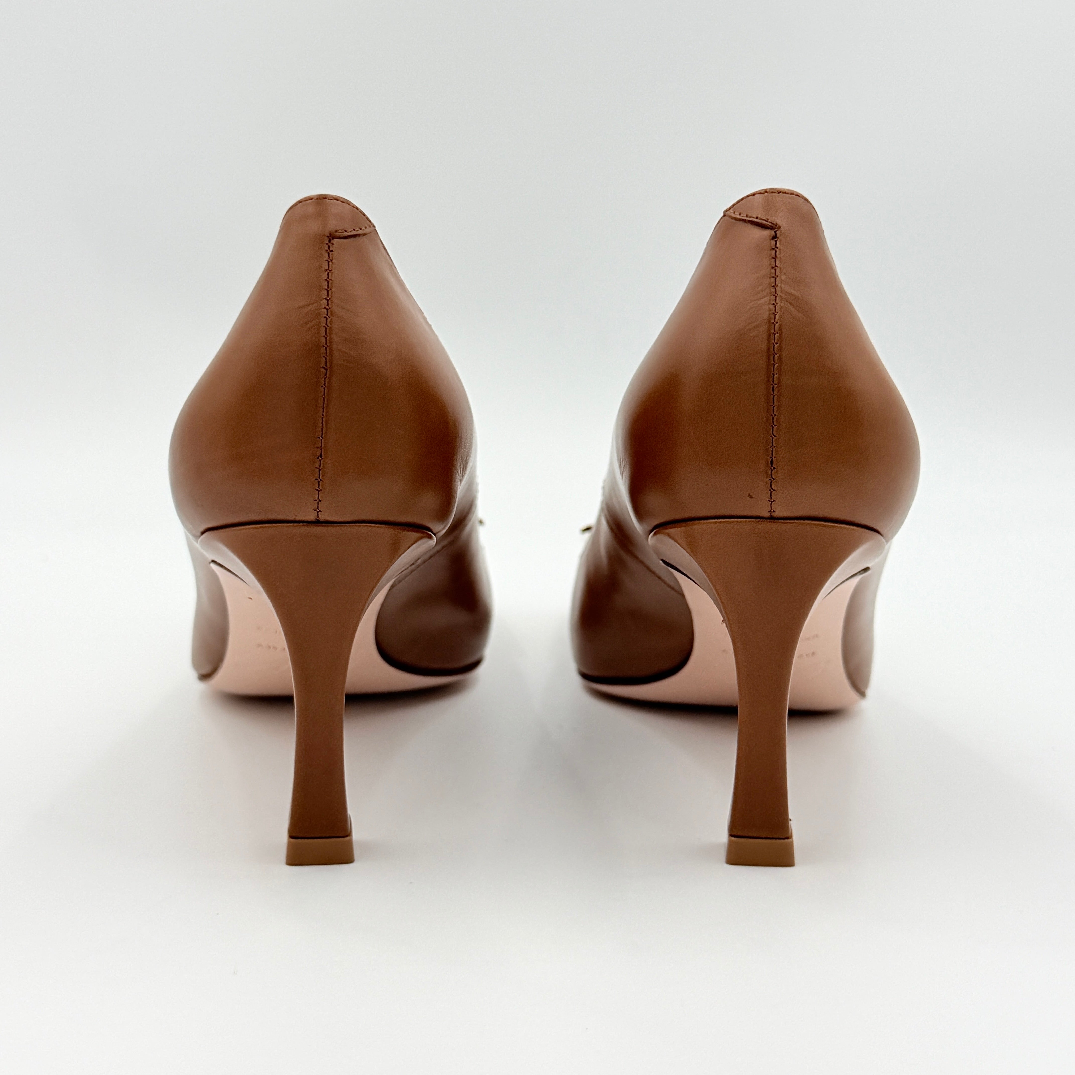 A pair of Roger Vivier Belle Vivier Trompette leather pumps in brown with gold-tone signature buckle and squared toe.