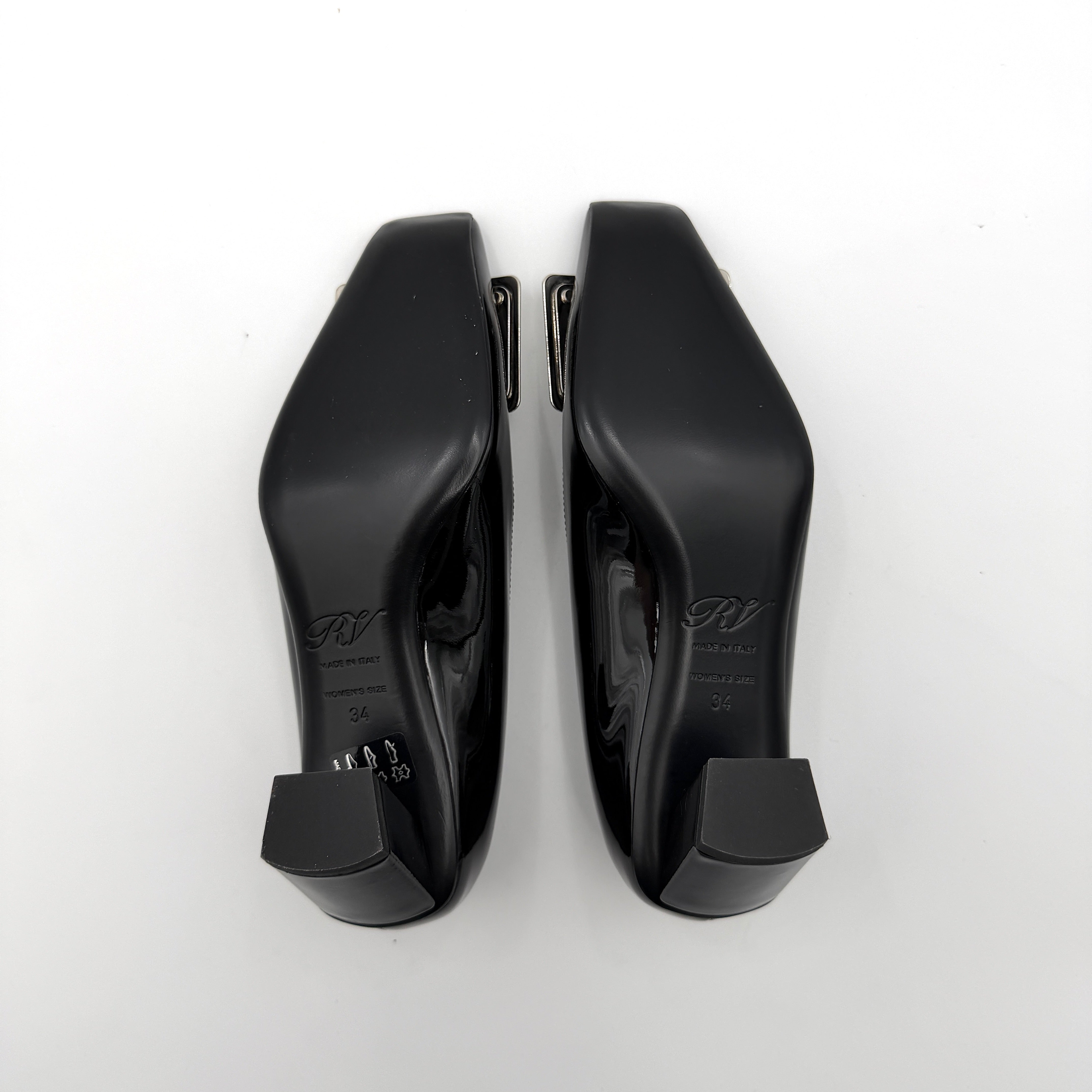 A pair of Roger Vivier Belle Vivier black patent pumps with signature silver-tone buckles, displayed at an angle.
