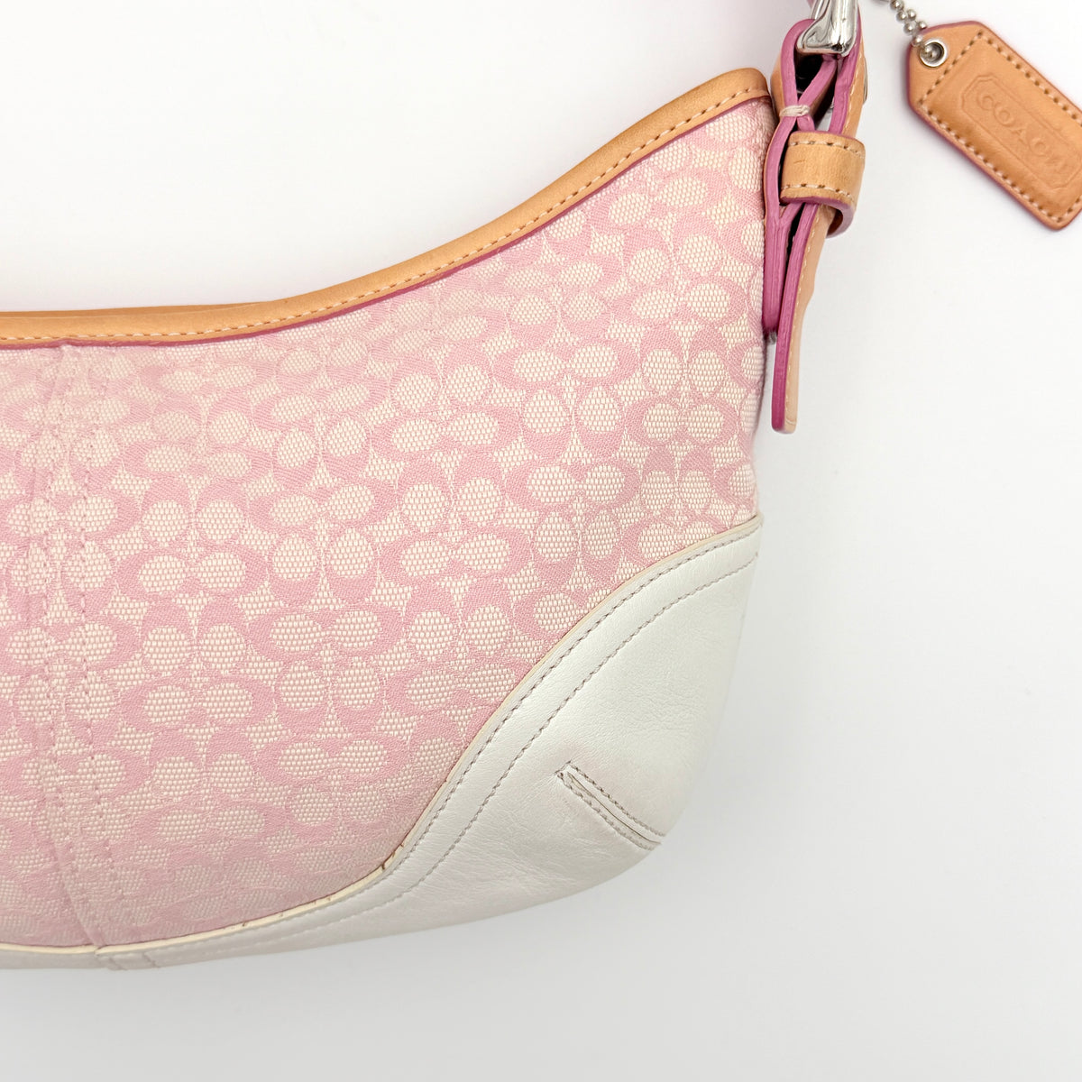 Coach Y2K Signature Hobo Shoulder Bag in pink jacquard with tan and white leather trim, shown on a white background.