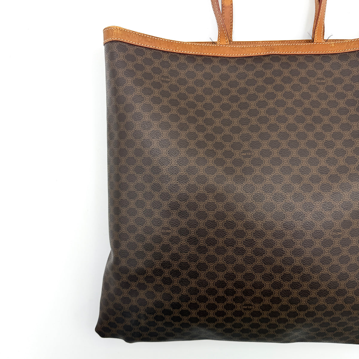Front view of the Celine Triomphe Macadam Tote Bag in brown coated canvas with tan leather detailing and double handles.