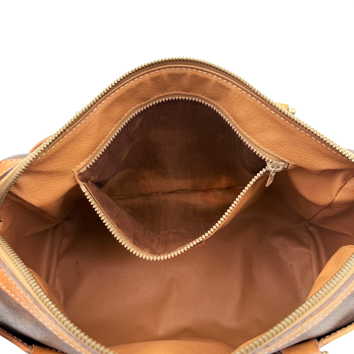 Celine Triomphe Macadam Boston Bag in brown coated canvas with tan leather trim and top handles, photographed against a white background.