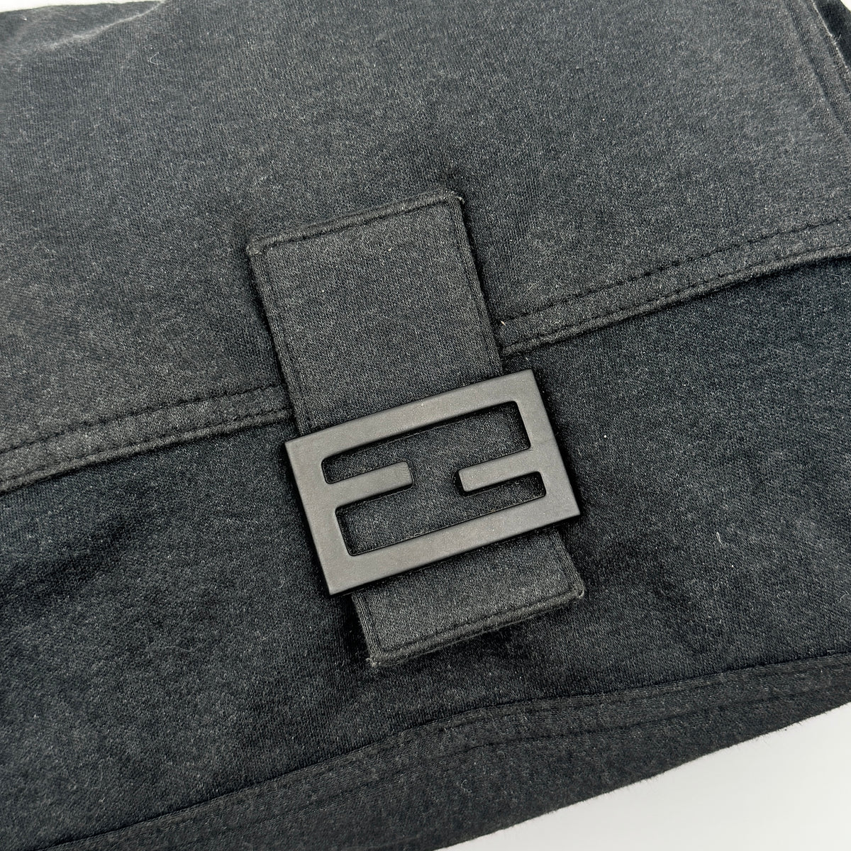 Fendi Mamma Baguette in grey textile with matte FF plaque, shown with original yellow Fendi dust bag.