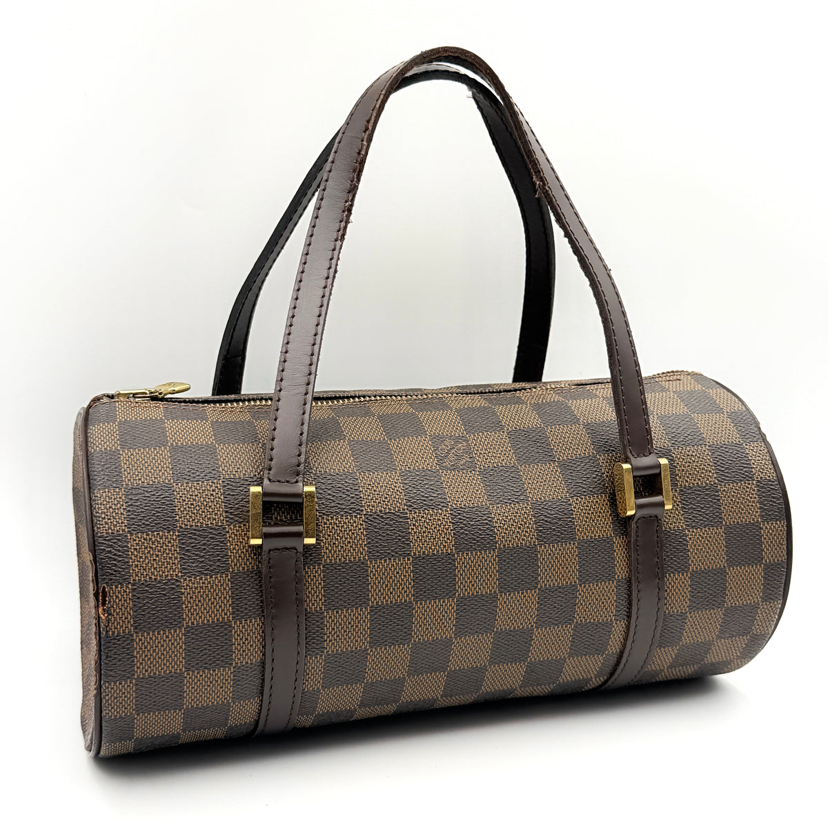 Louis Vuitton Damier Ebene Papillon 26 handbag in brown checked canvas with chocolate leather handles and gold hardware against a white background.