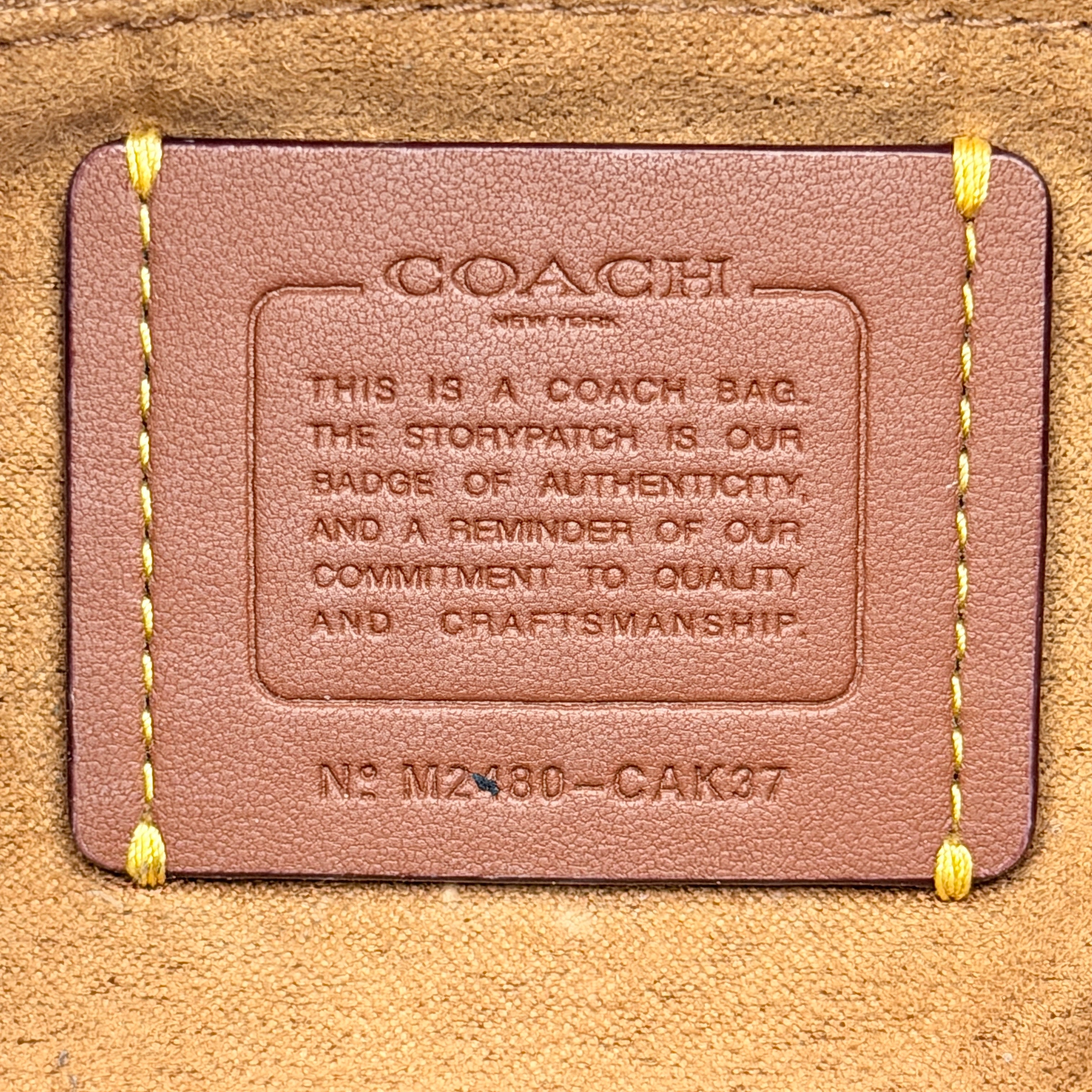 Coach Faye Shoulder Bag in blue denim with navy leather strap and detachable crossbody, styled simply against a white background.