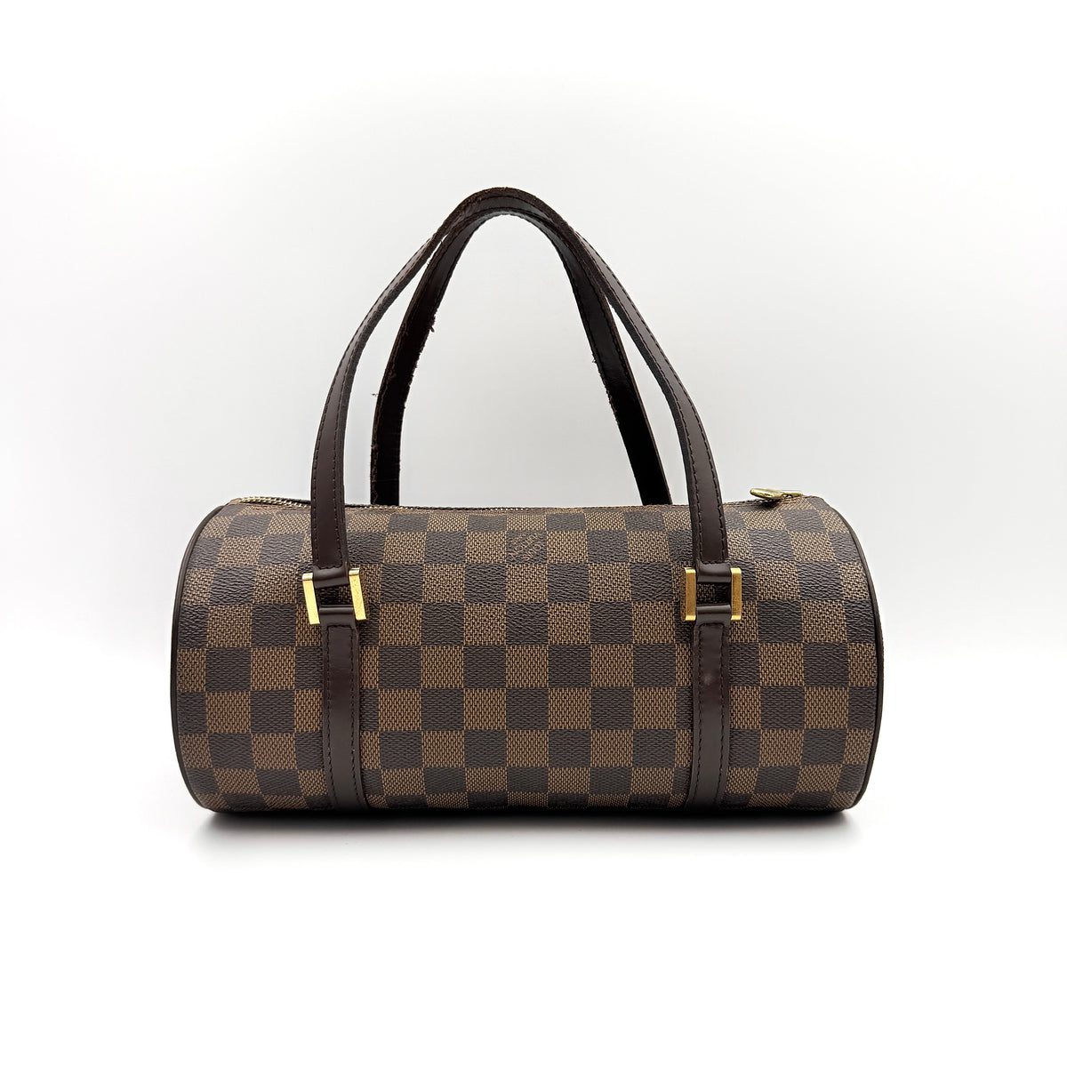Louis Vuitton Damier Ebene Papillon 26 handbag in brown checked canvas with chocolate leather handles and gold hardware against a white background.