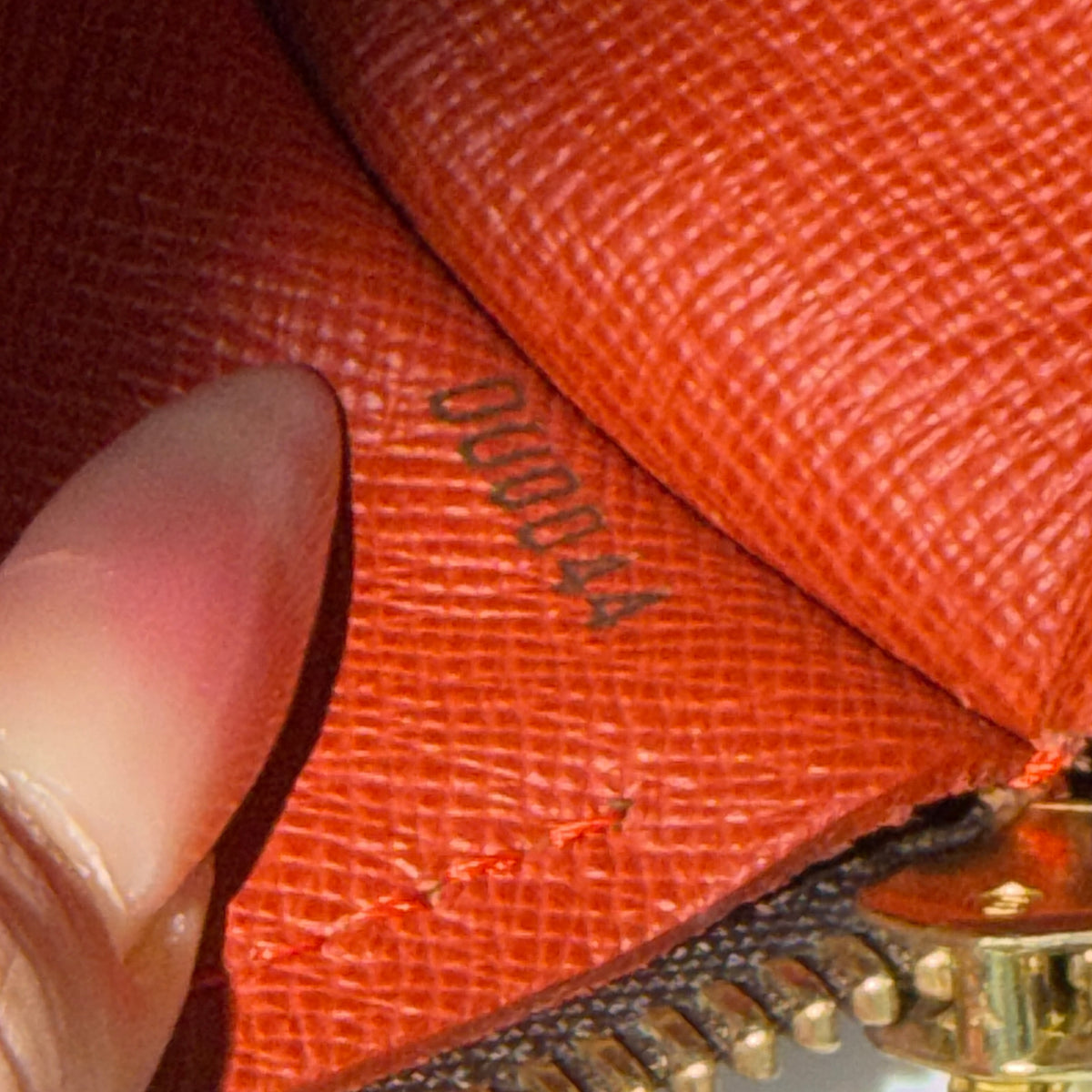 Louis Vuitton Damier Ebene Papillon 26 handbag in brown checked canvas with chocolate leather handles and gold hardware against a white background.