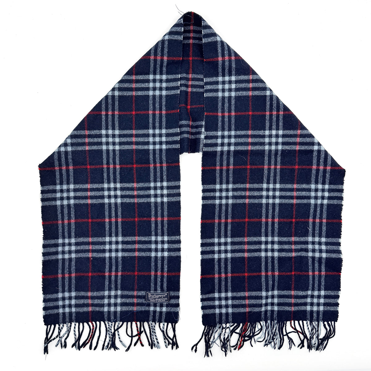 Burberrys navy Nova Check lambswool shawl scarf with tassel ends, shown folded against a white background.