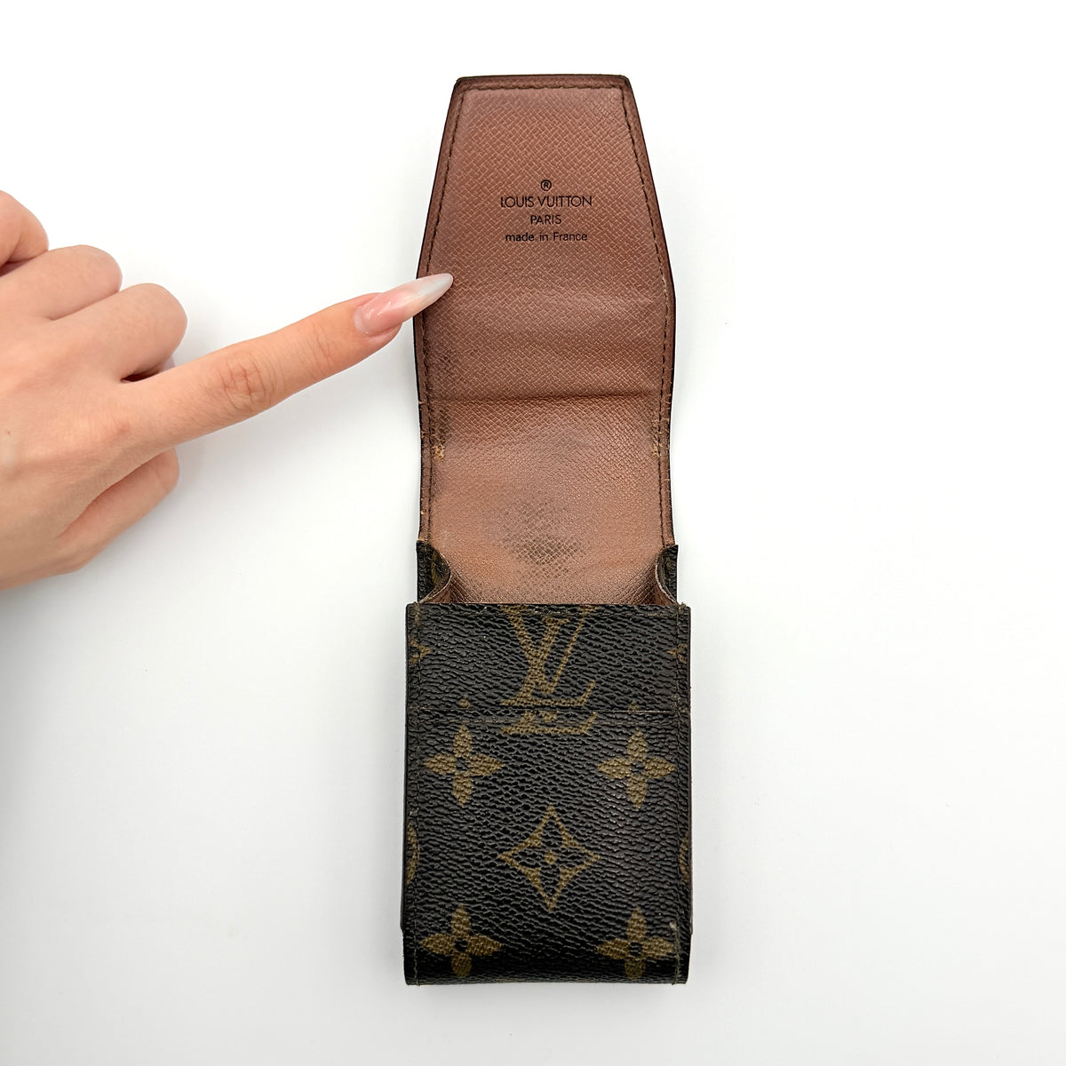 Front view of the Louis Vuitton Monogram Cigarette Case in brown coated canvas, showcasing the classic LV monogram print.