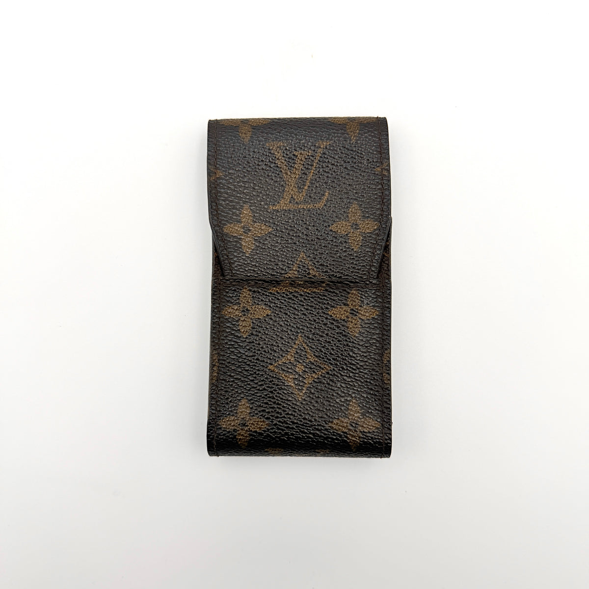 Louis Vuitton monogram brown cigarette case with flap closure on white background