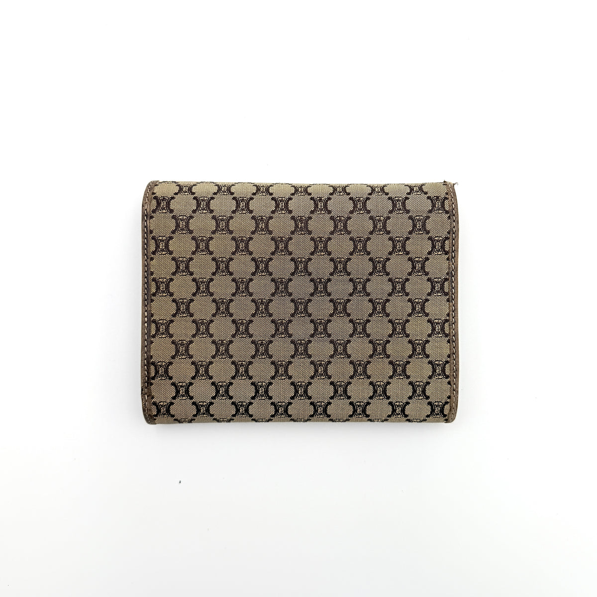 Celine Macadam Monogram Trifold Wallet in brown coated canvas with all-over motif, photographed closed on a white background