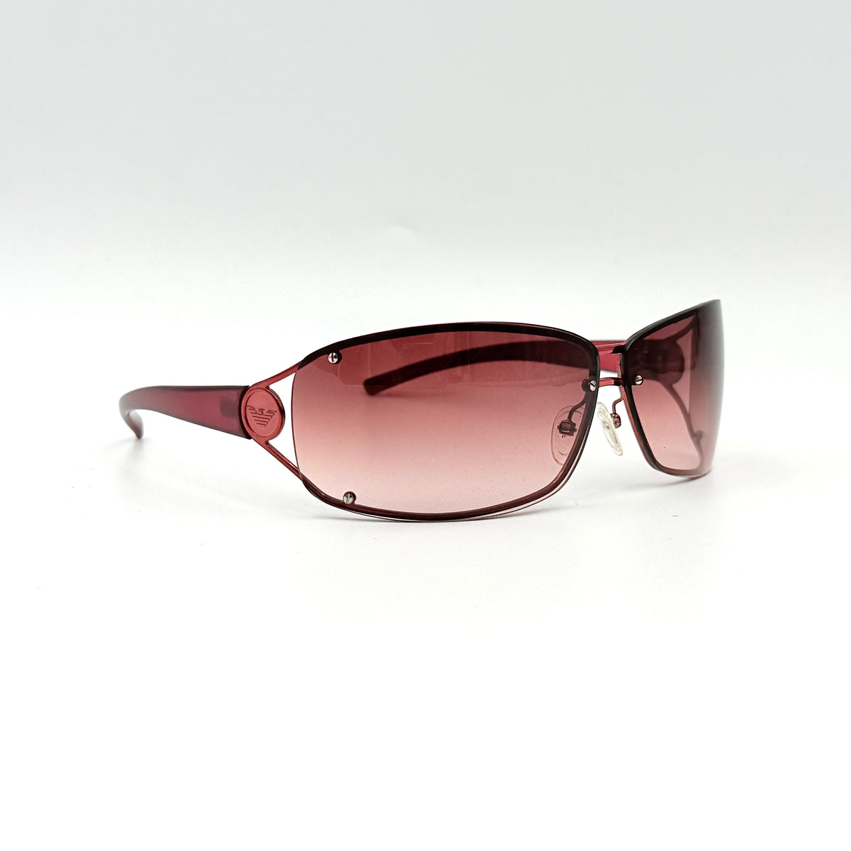 Emporio Armani EA 9251/S sunglasses in translucent red with gradient lenses and silver-tone logo detail at the temple.
