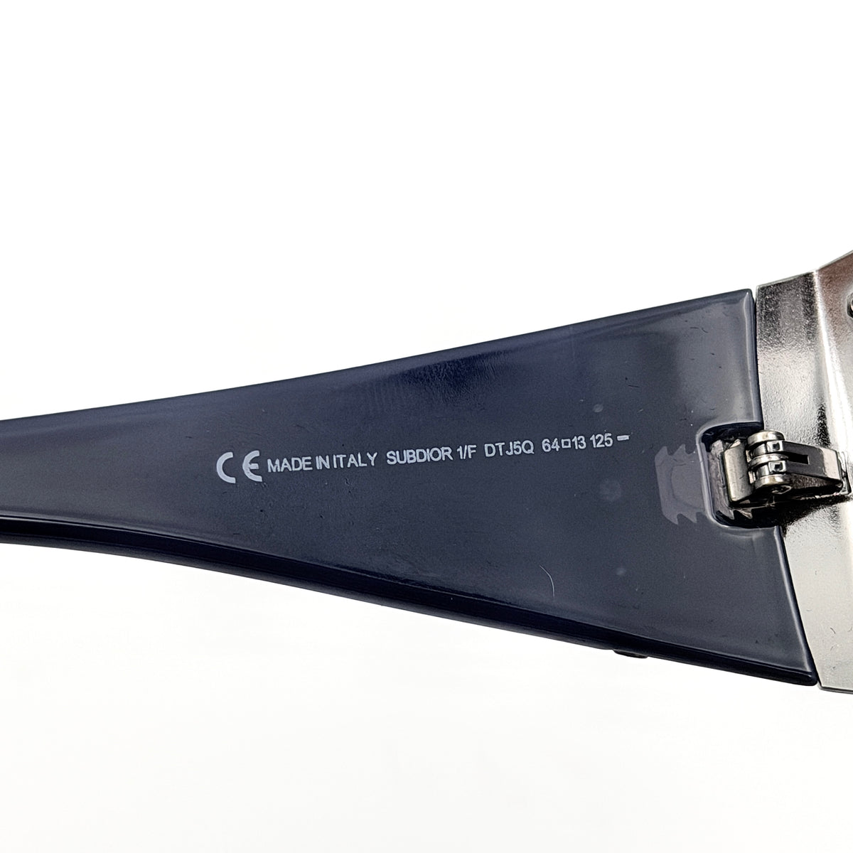 Christian Dior SUBDIOR 1/F sunglasses in navy blue with wide arms, gradient lenses, and silver-tone logo detail at the temples.