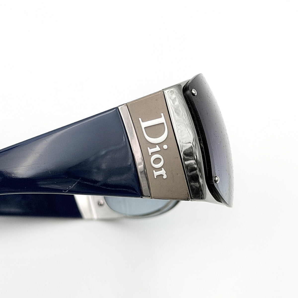 Christian Dior SUBDIOR 1/F sunglasses in navy blue with wide arms, gradient lenses, and silver-tone logo detail at the temples.