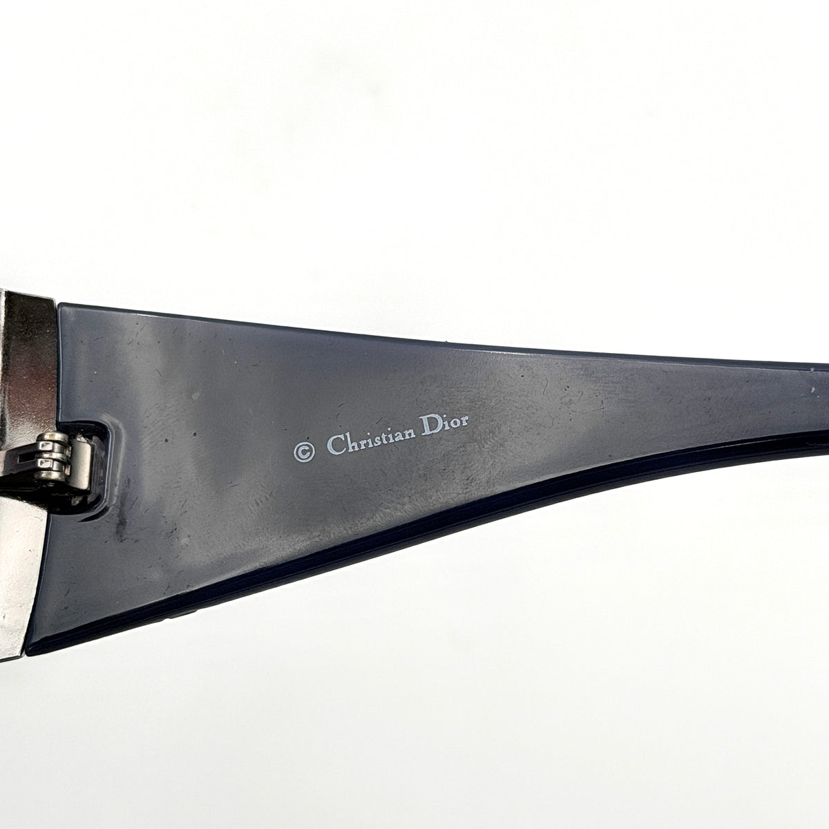 Christian Dior SUBDIOR 1/F sunglasses in navy blue with wide arms, gradient lenses, and silver-tone logo detail at the temples.