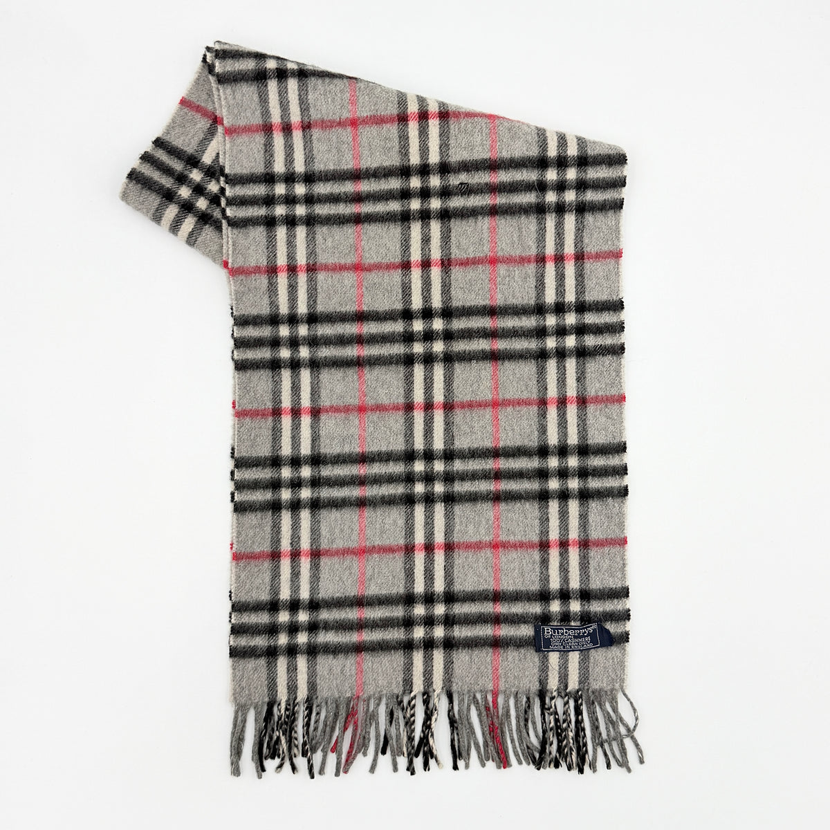 Burberry grey cashmere scarf with Nova Check pattern and classic fringe, featuring a Burberrys of London label.