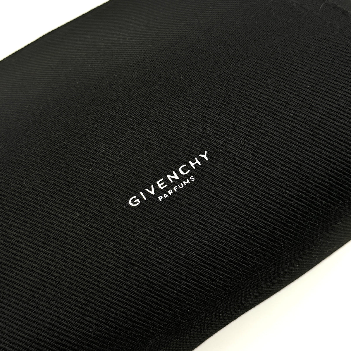 Givenchy black cosmetic pouch with silver-tone logo plaque and zip, photographed against a clean white background.
