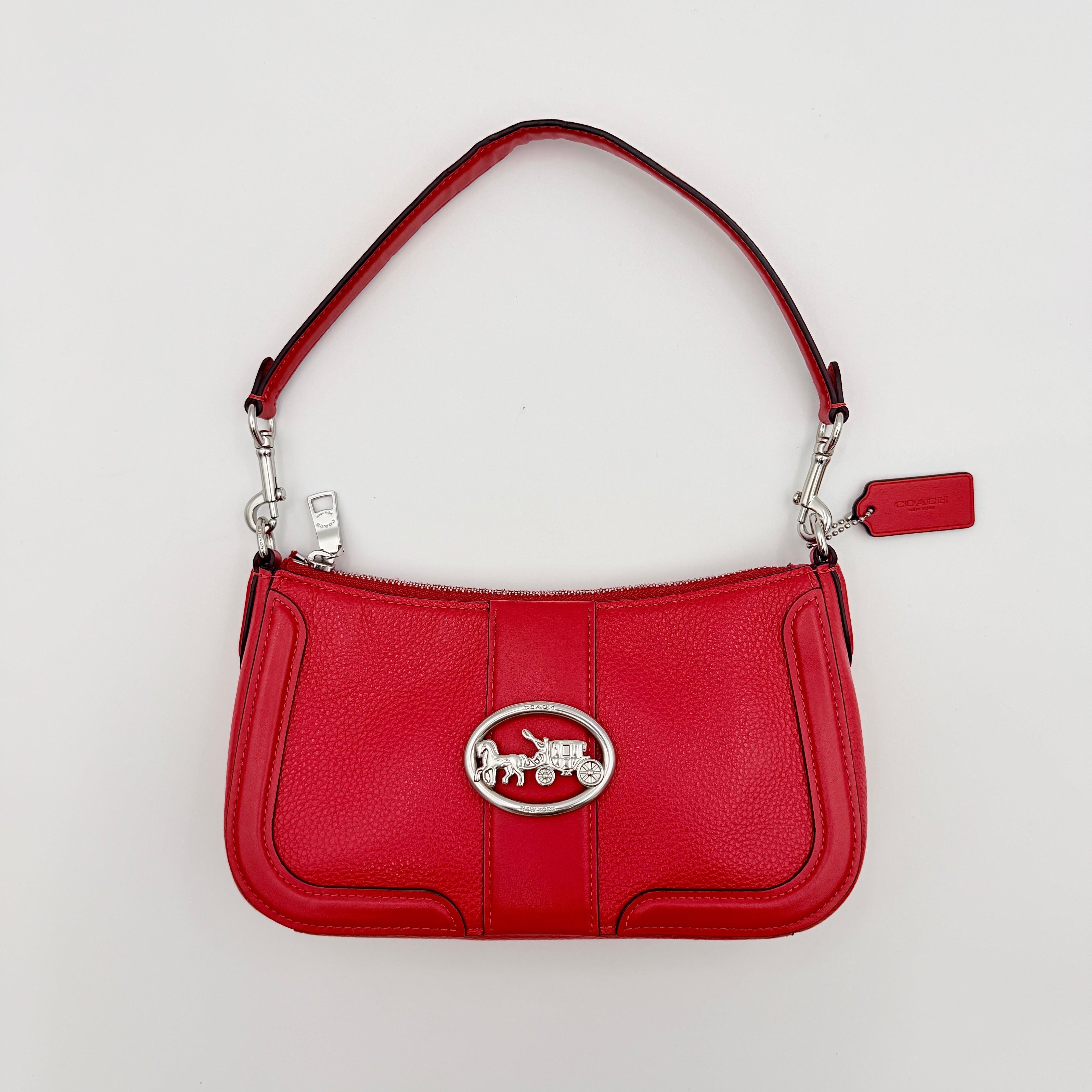 Coach 2Way Georgie Baguette in red pebbled leather with silver carriage logo hardware, shown with removable shoulder strap.