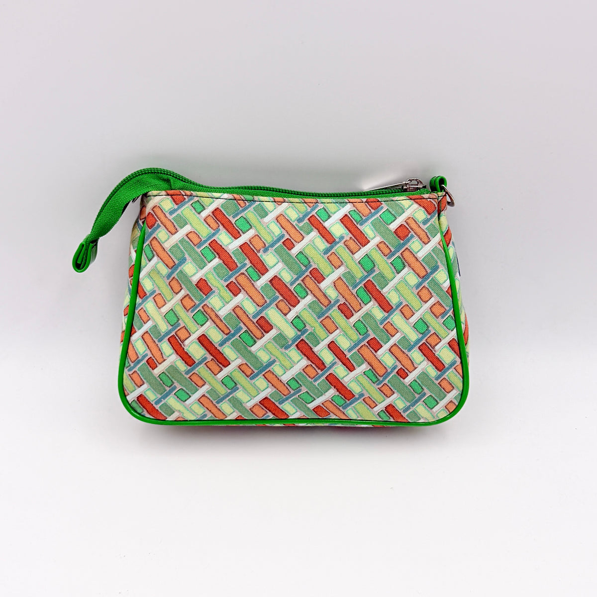 Burberry Blue Label geometric pouch in multicolor canvas with green trim and zip closure, photographed against a clean white background.