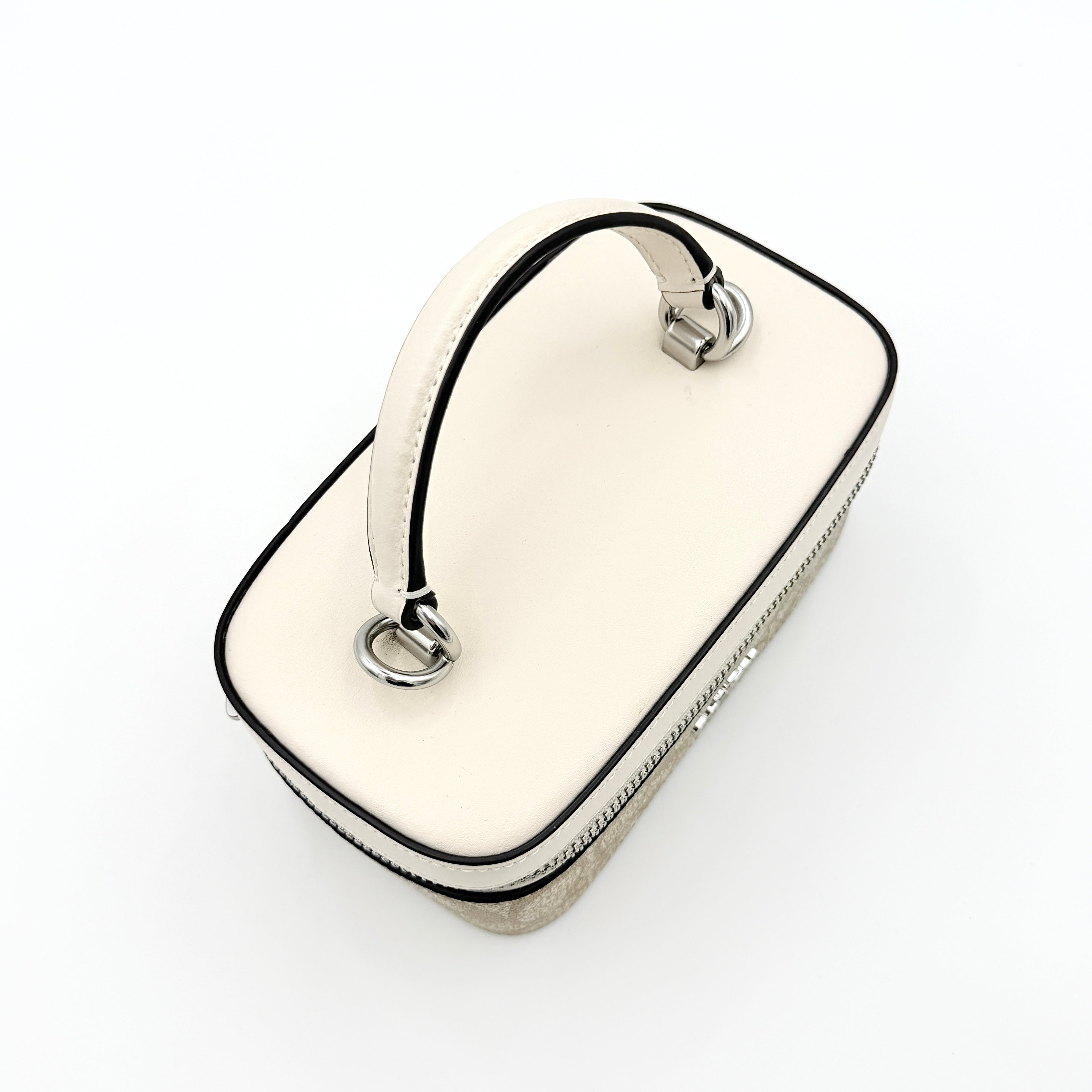 Coach 2Way Signature Train Case in beige and white canvas with a leather top handle and detachable strap, shown with silver zip hardware.