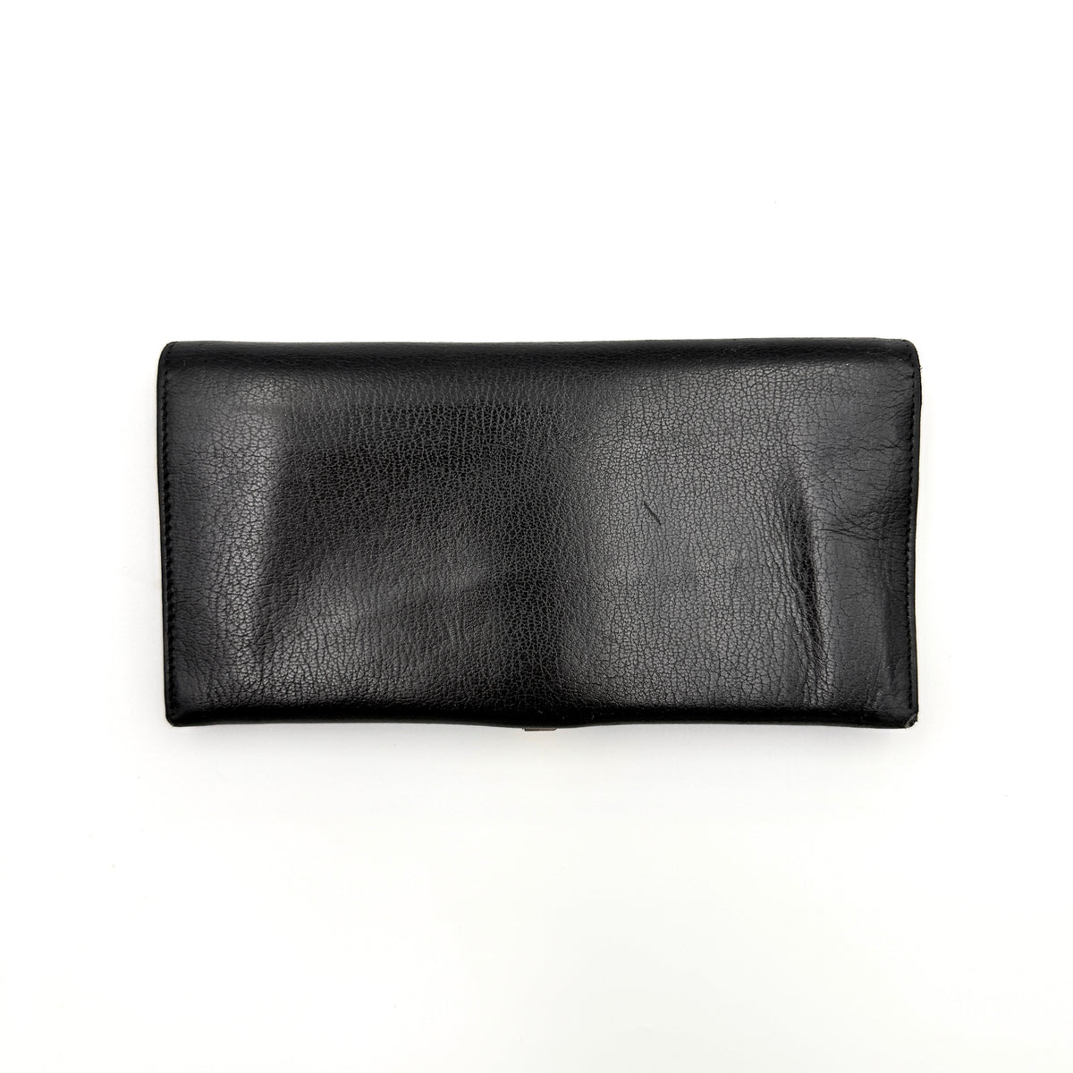 Salvatore Ferragamo Gancini Continental Wallet in black leather with gold-tone Gancini clasp, photographed closed on a white background.
