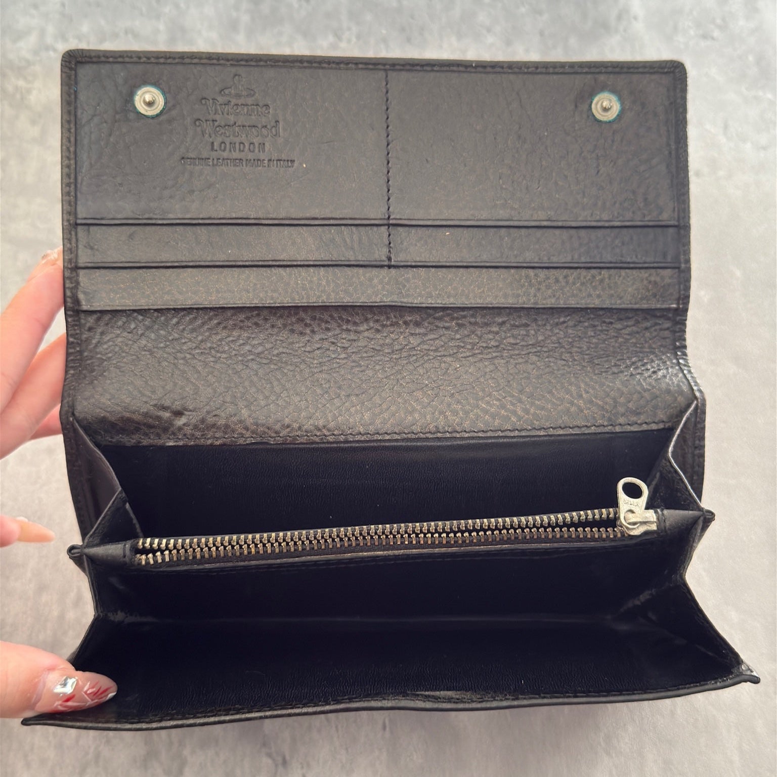Vivienne Westwood Icon Signature Long Wallet in black leather, featuring logo plaque, multiple card slots and zip compartment interior, snap button closure, vintage condition.