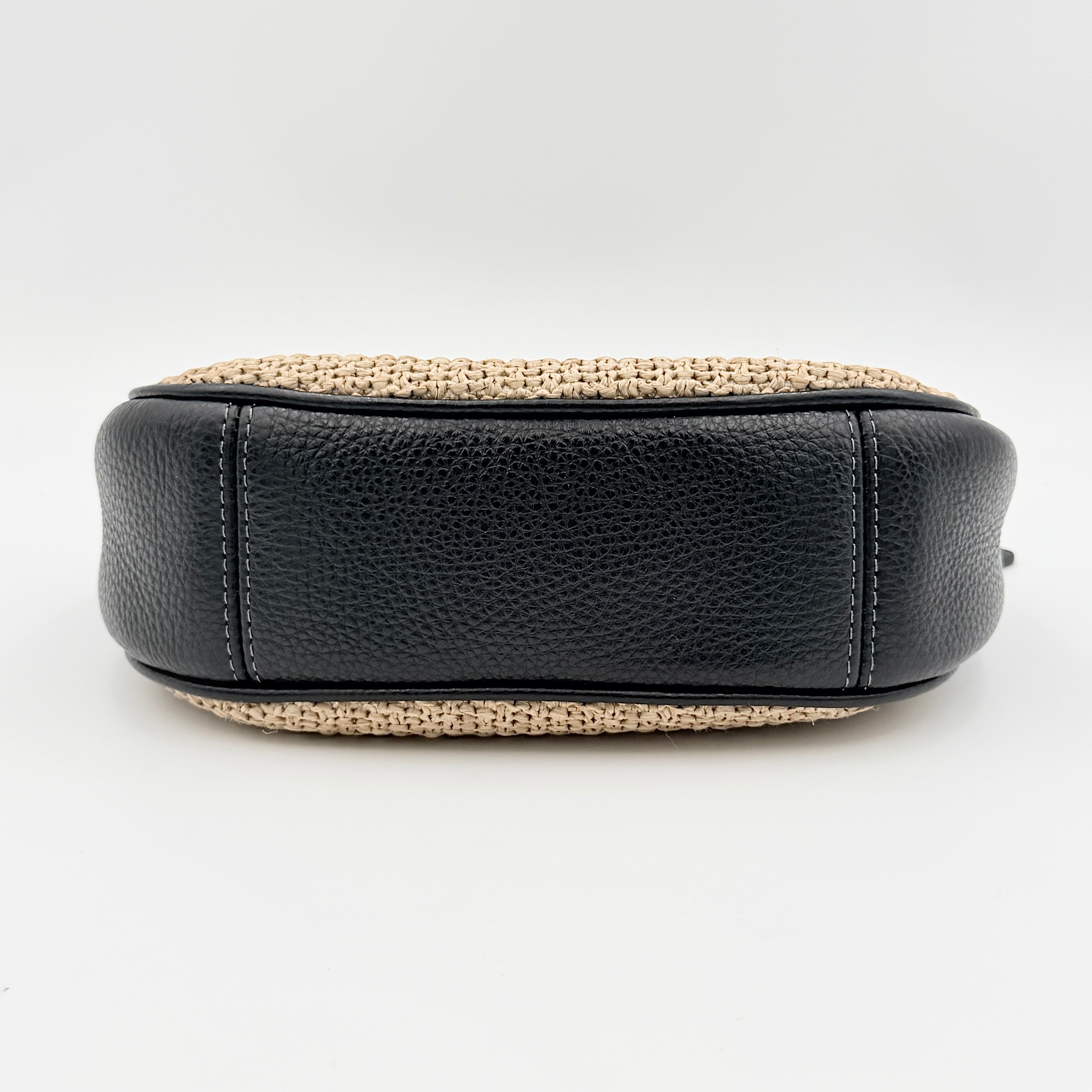 Coach Carmen Mini 2Way Shoulder Bag in beige and black with textured woven body, leather trim, and gold-tone hardware.
