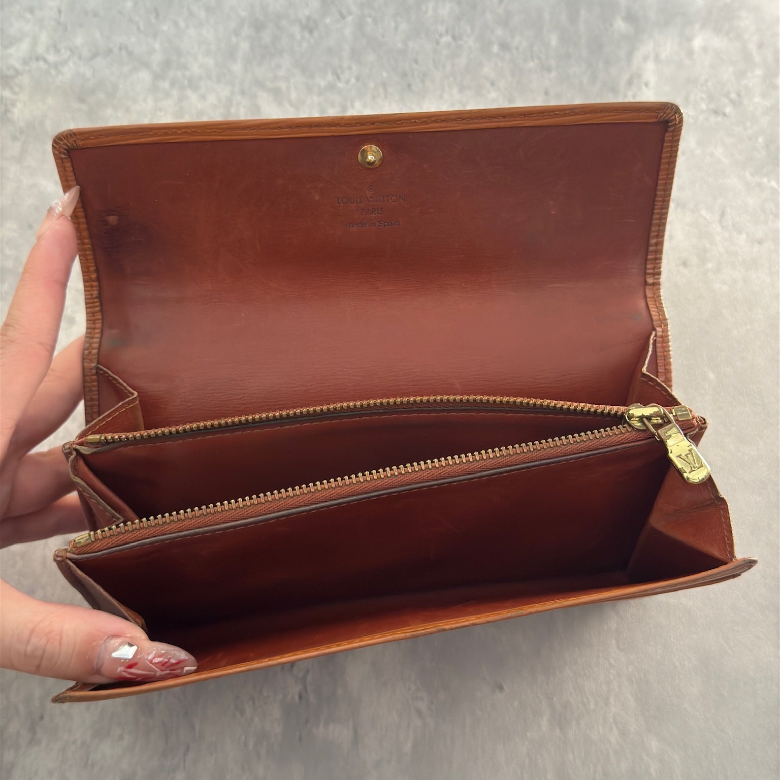 Louis Vuitton Cipango Gold Epi Leather Flap Continental Wallet in a discontinued warm golden hue, crafted from textured Epi leather with an embossed LV logo and multiple compartments.