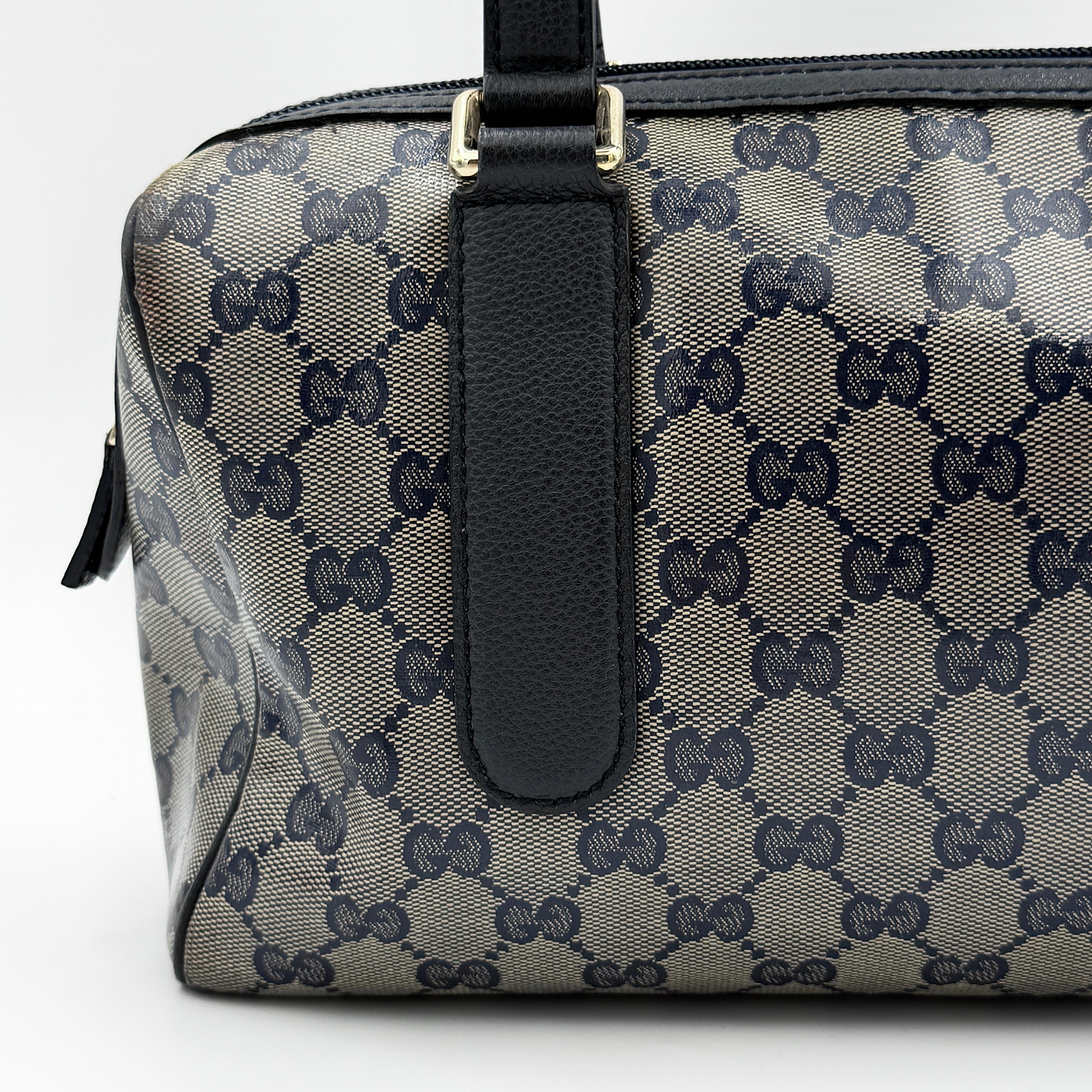 Front-facing view of the Gucci GG Monogram Crystal Boston Bag in grey and black with dual top handles and signature GG canvas.