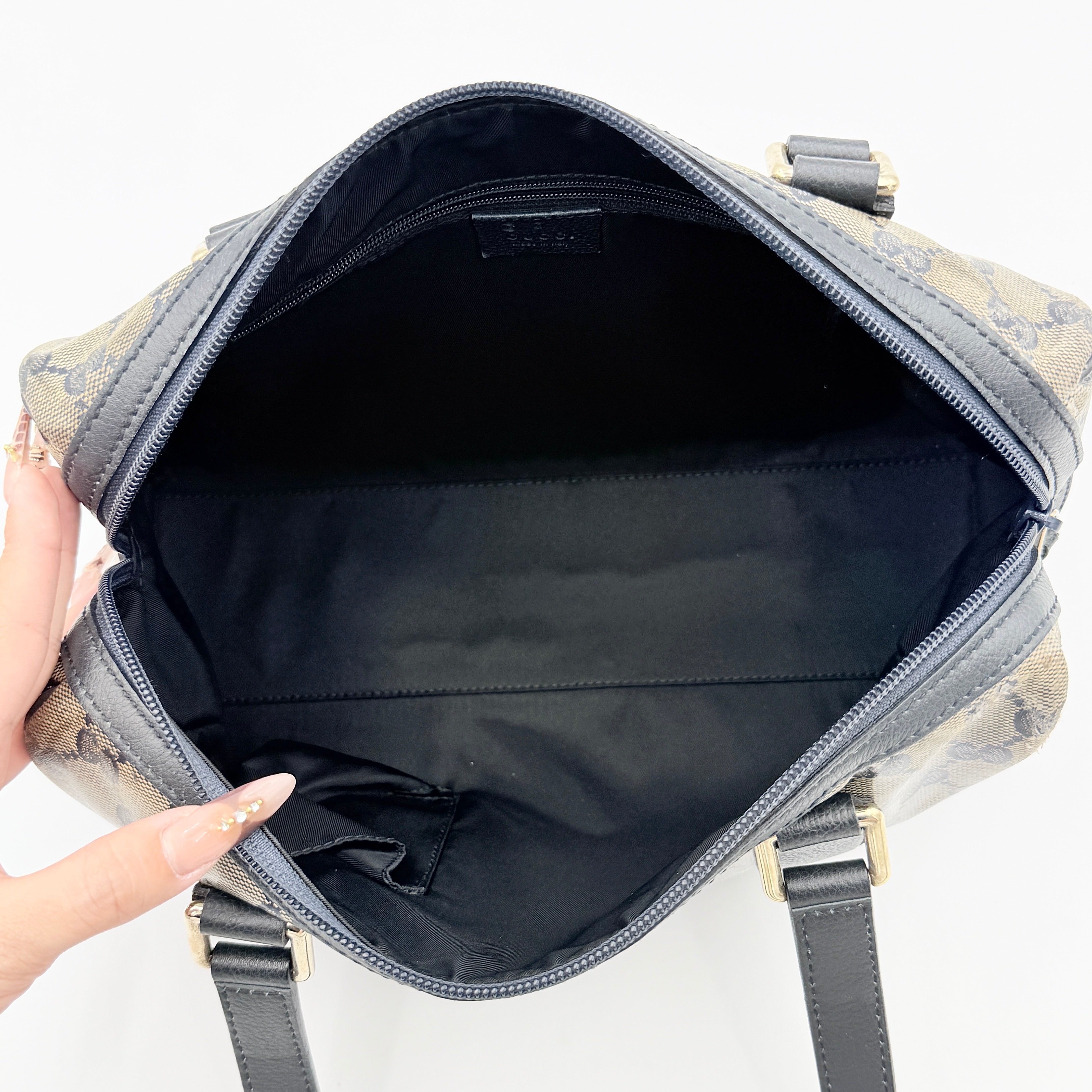 Front-facing view of the Gucci GG Monogram Crystal Boston Bag in grey and black with dual top handles and signature GG canvas.