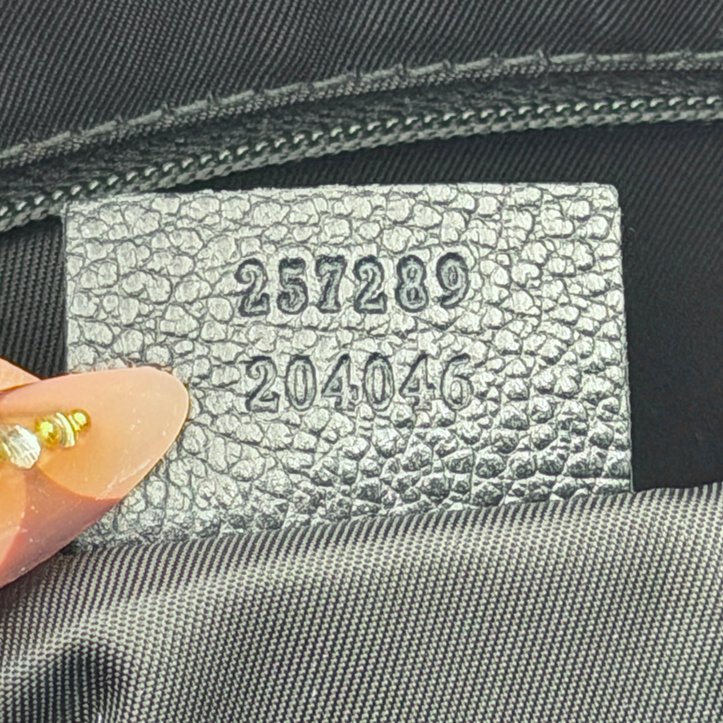 Front-facing view of the Gucci GG Monogram Crystal Boston Bag in grey and black with dual top handles and signature GG canvas.