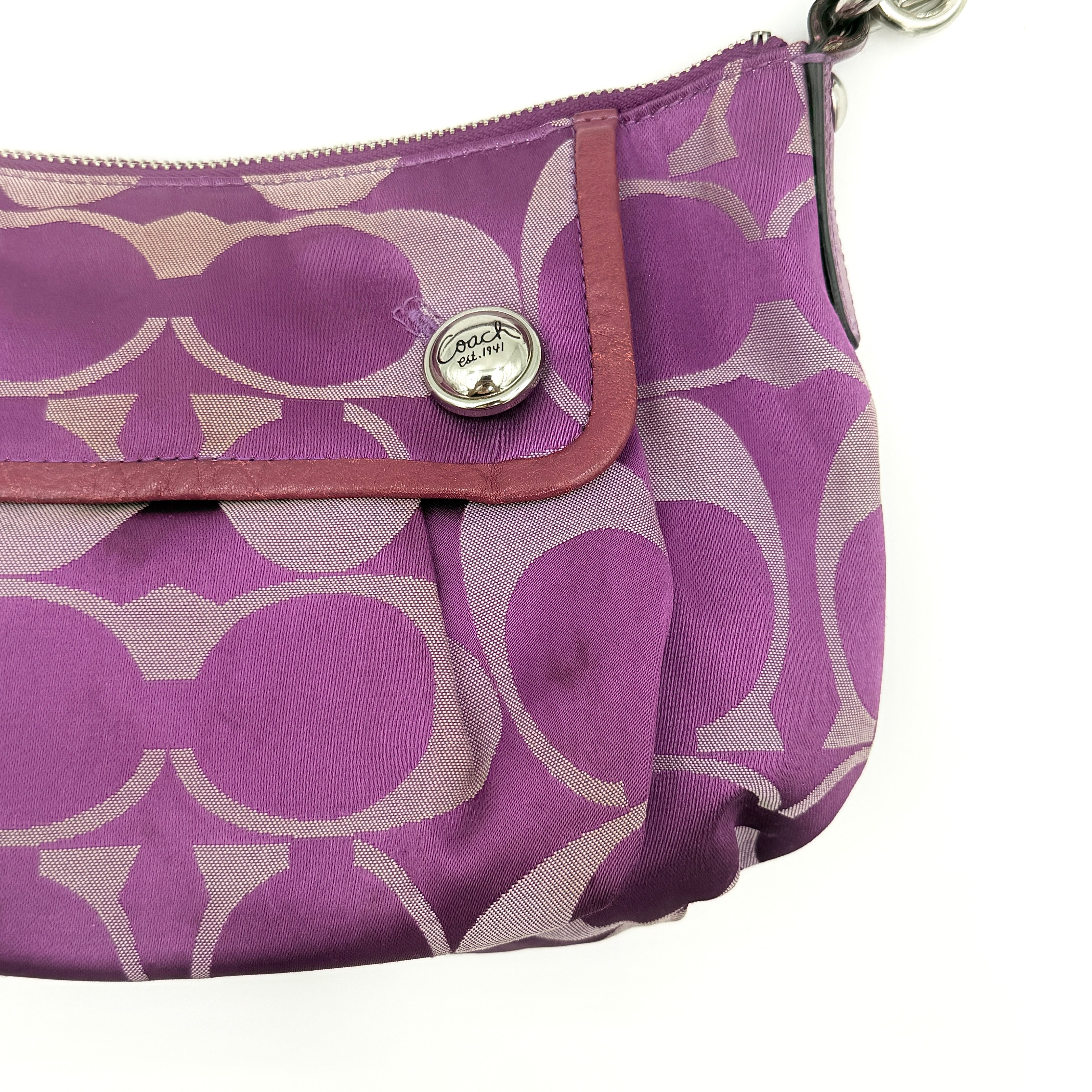 Coach 2Way Signature Shoulder Bag in purple canvas with detachable strap and top handle.
