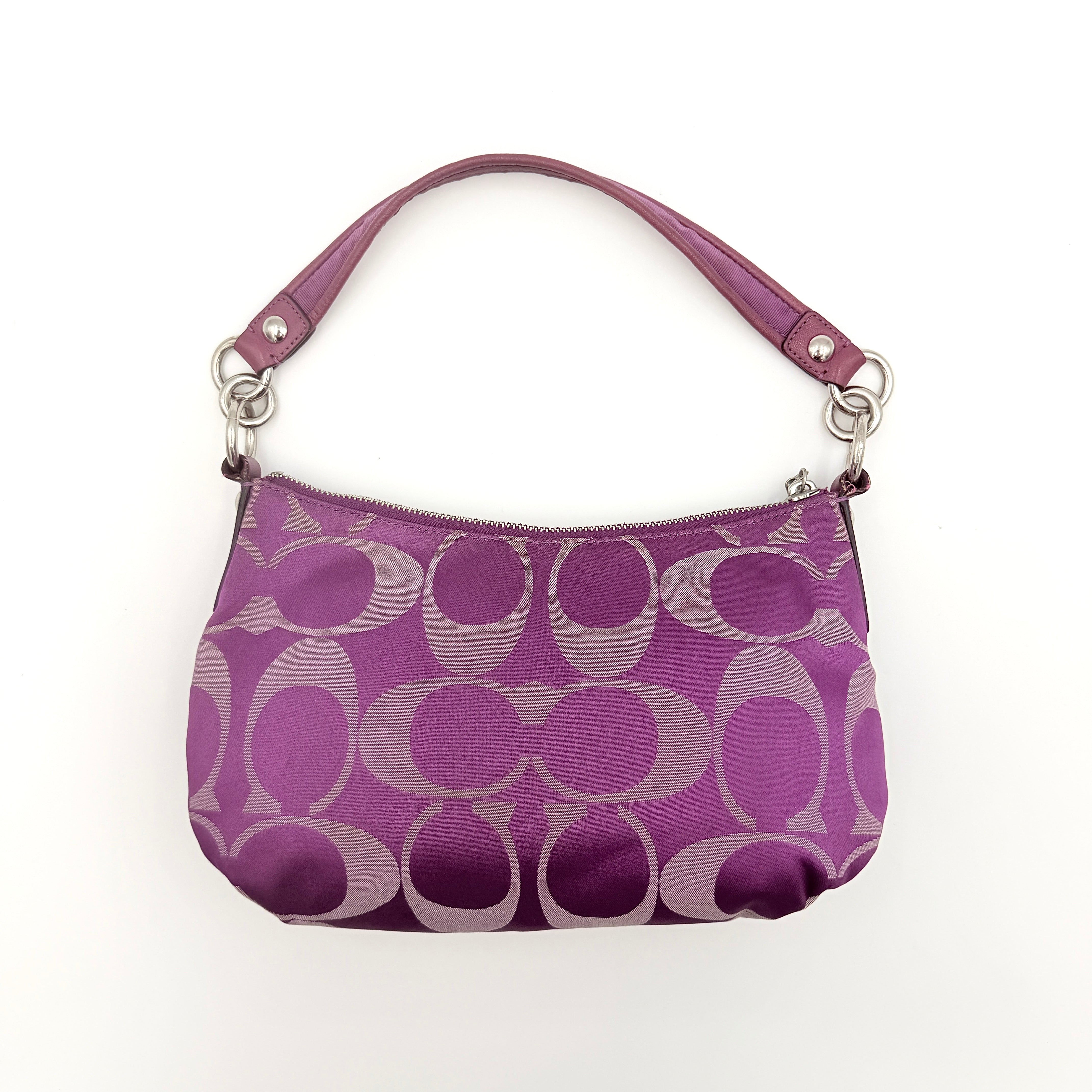 Coach 2Way Signature Shoulder Bag in purple canvas with detachable strap and top handle.