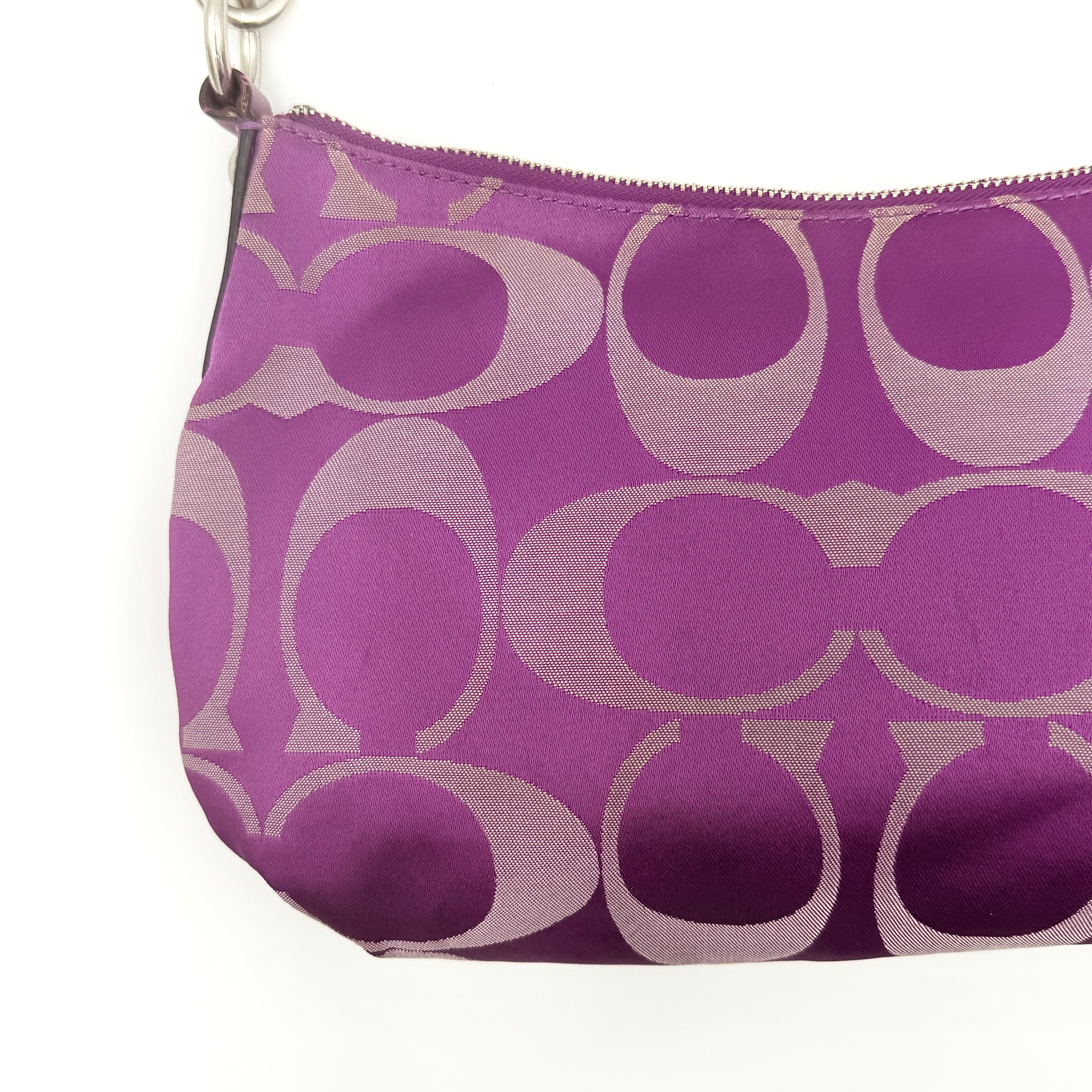 Coach 2Way Signature Shoulder Bag in purple canvas with detachable strap and top handle.
