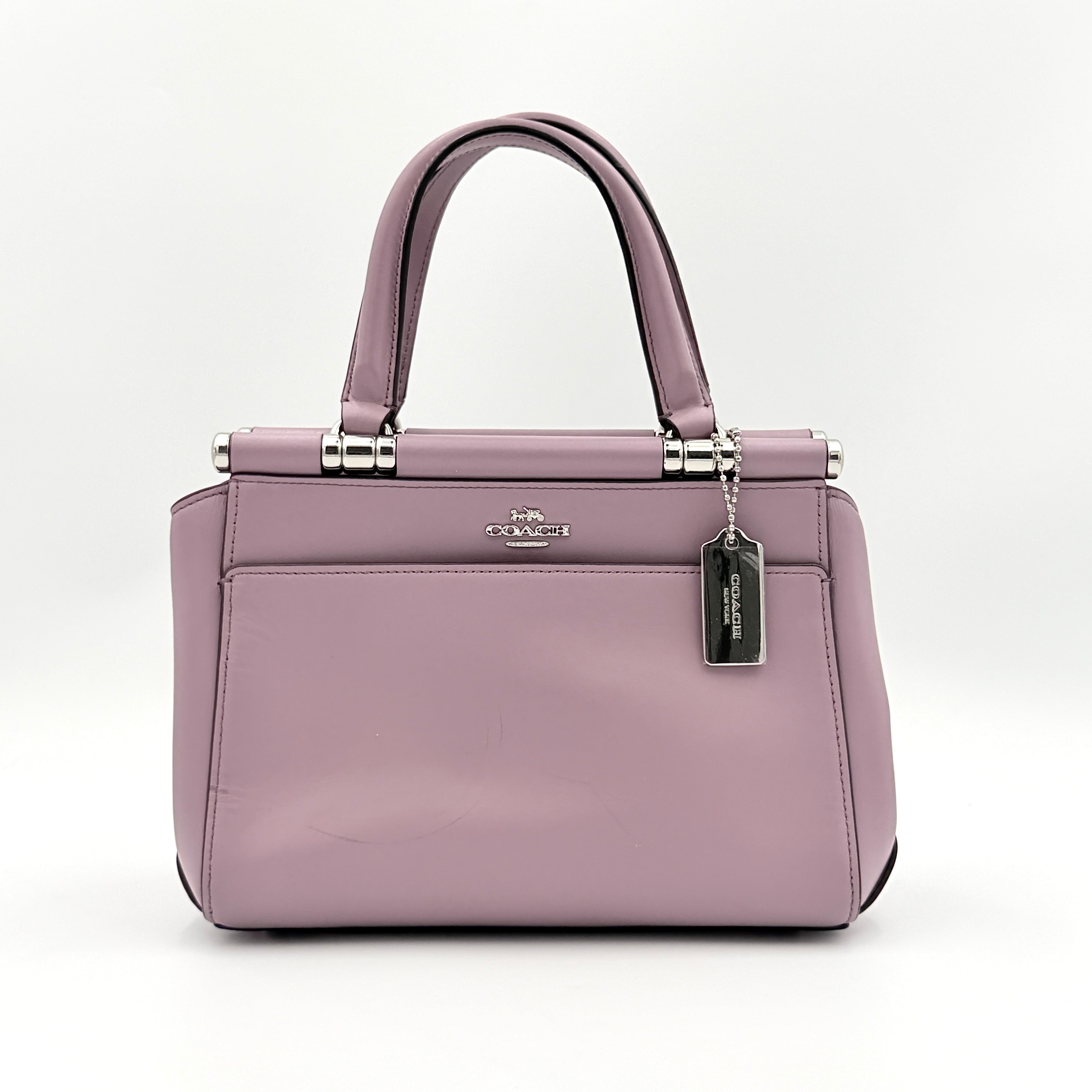 Coach Grace 20 bag in pink leather with silver hardware, shown with its detachable strap.