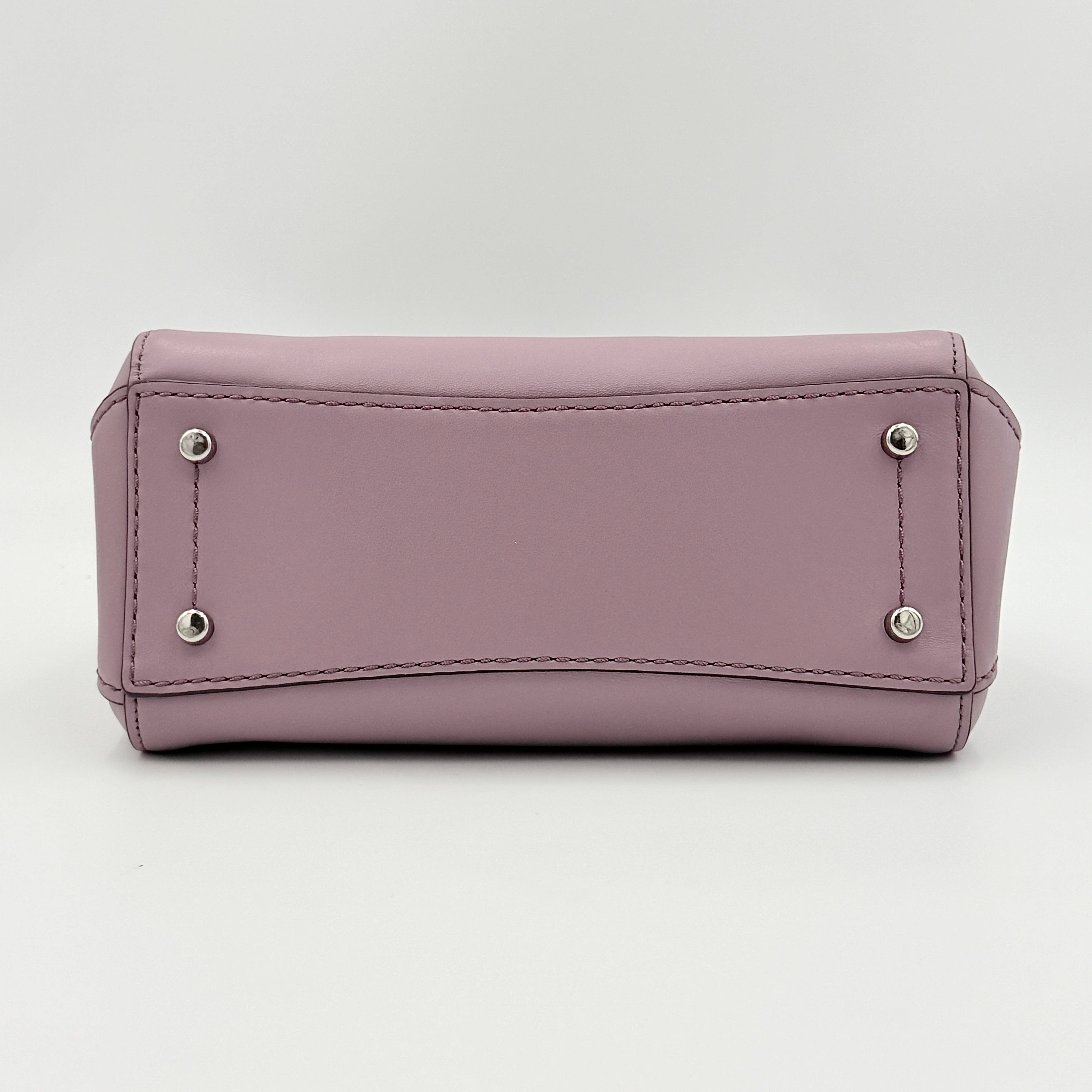 Coach Grace 20 bag in pink leather with silver hardware, shown with its detachable strap.
