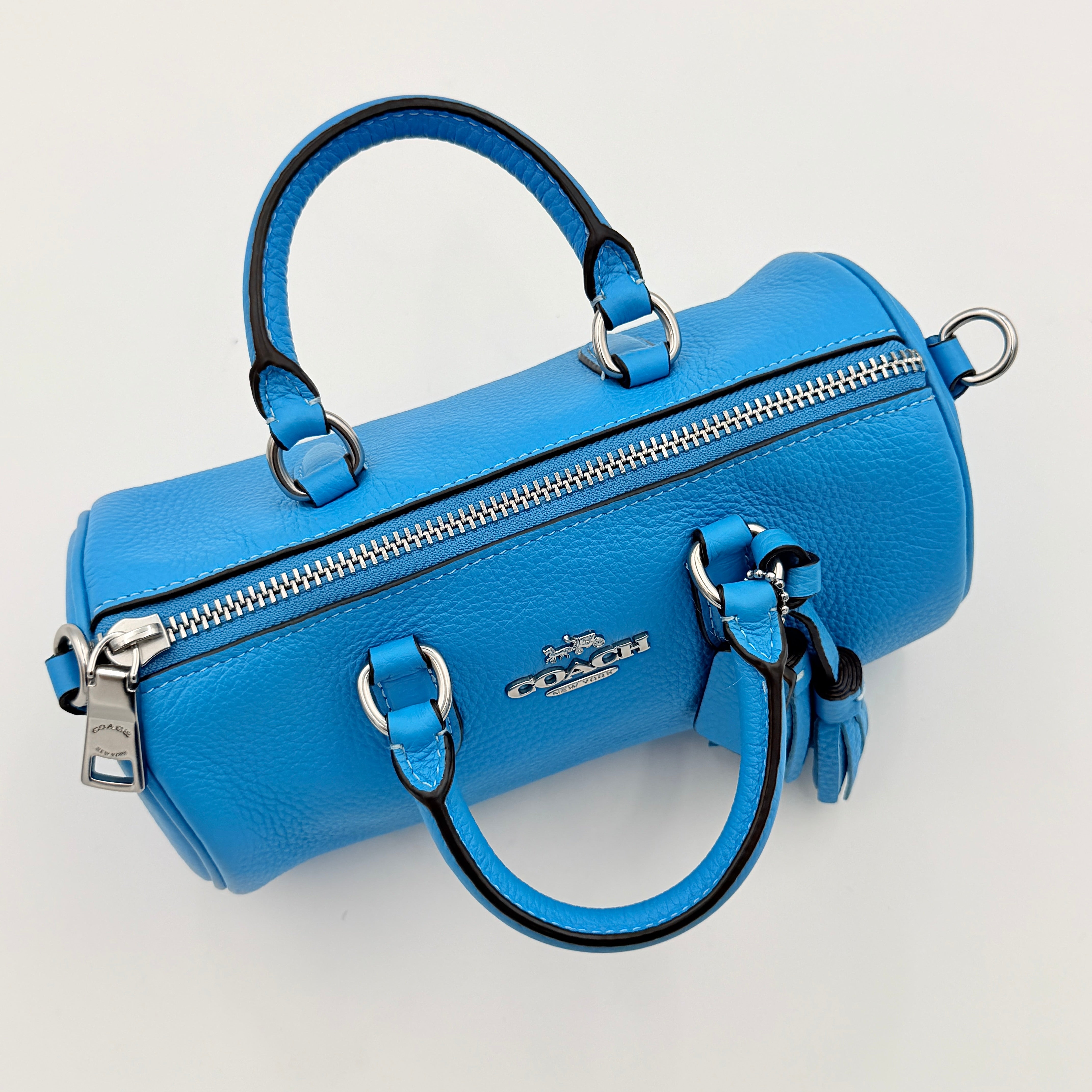 Coach 2Way Lacey Mini Boston Bag in blue pebbled leather with silver hardware and detachable strap, displayed against a clean background.