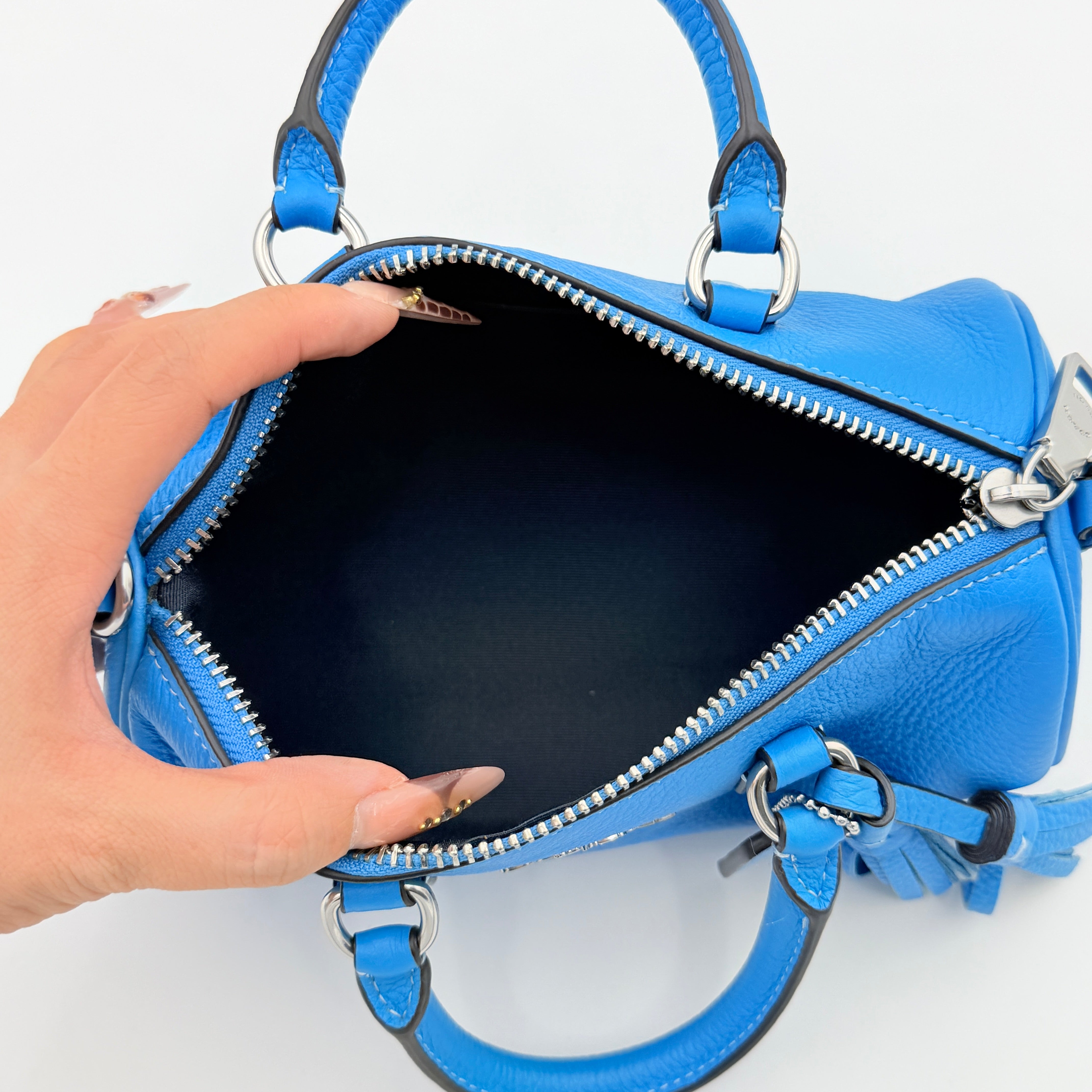 Coach 2Way Lacey Mini Boston Bag in blue pebbled leather with silver hardware and detachable strap, displayed against a clean background.