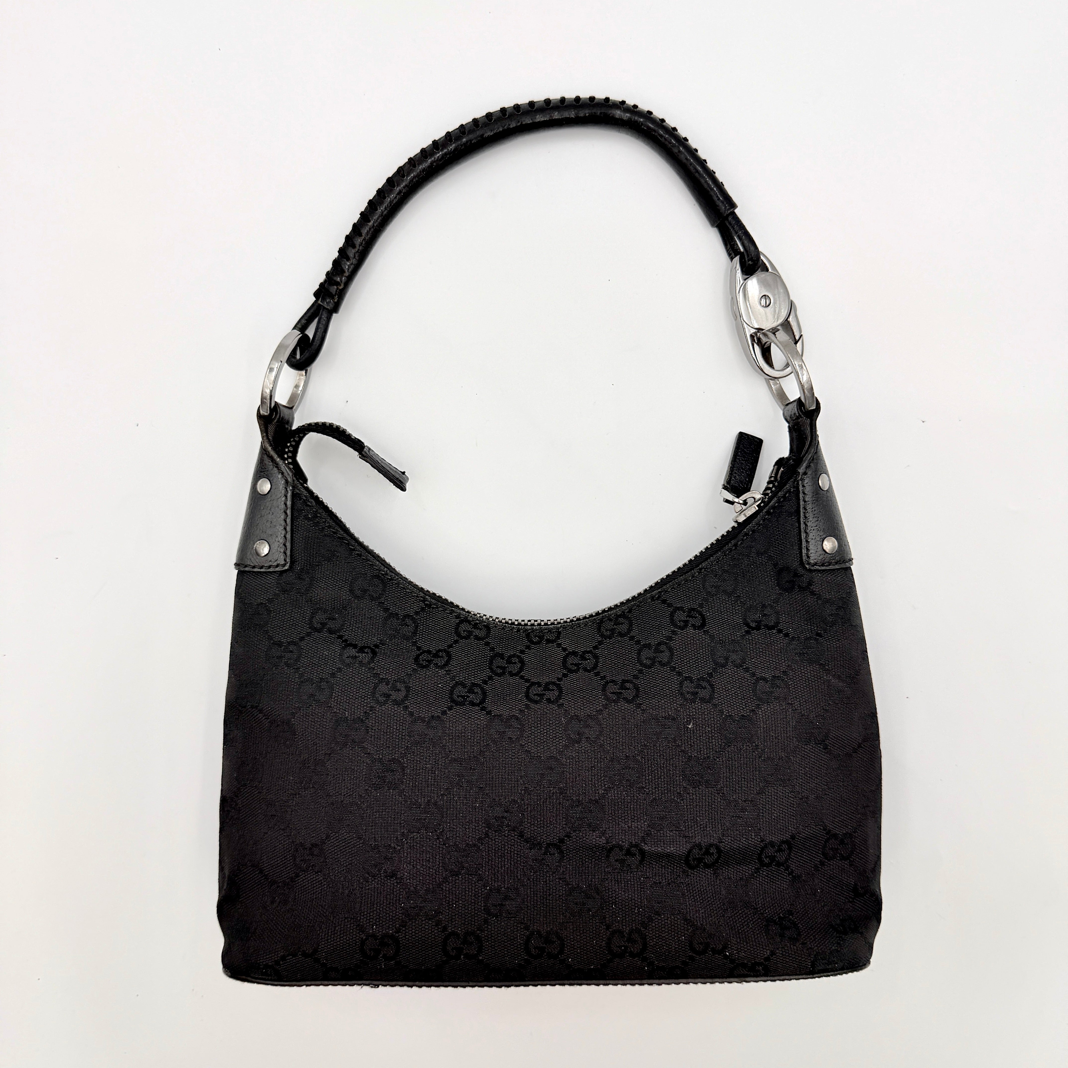 Gucci GG Monogram Lock Hobo Shoulder Bag in black jacquard canvas with leather trim and silver-tone hardware, shown on a white background.