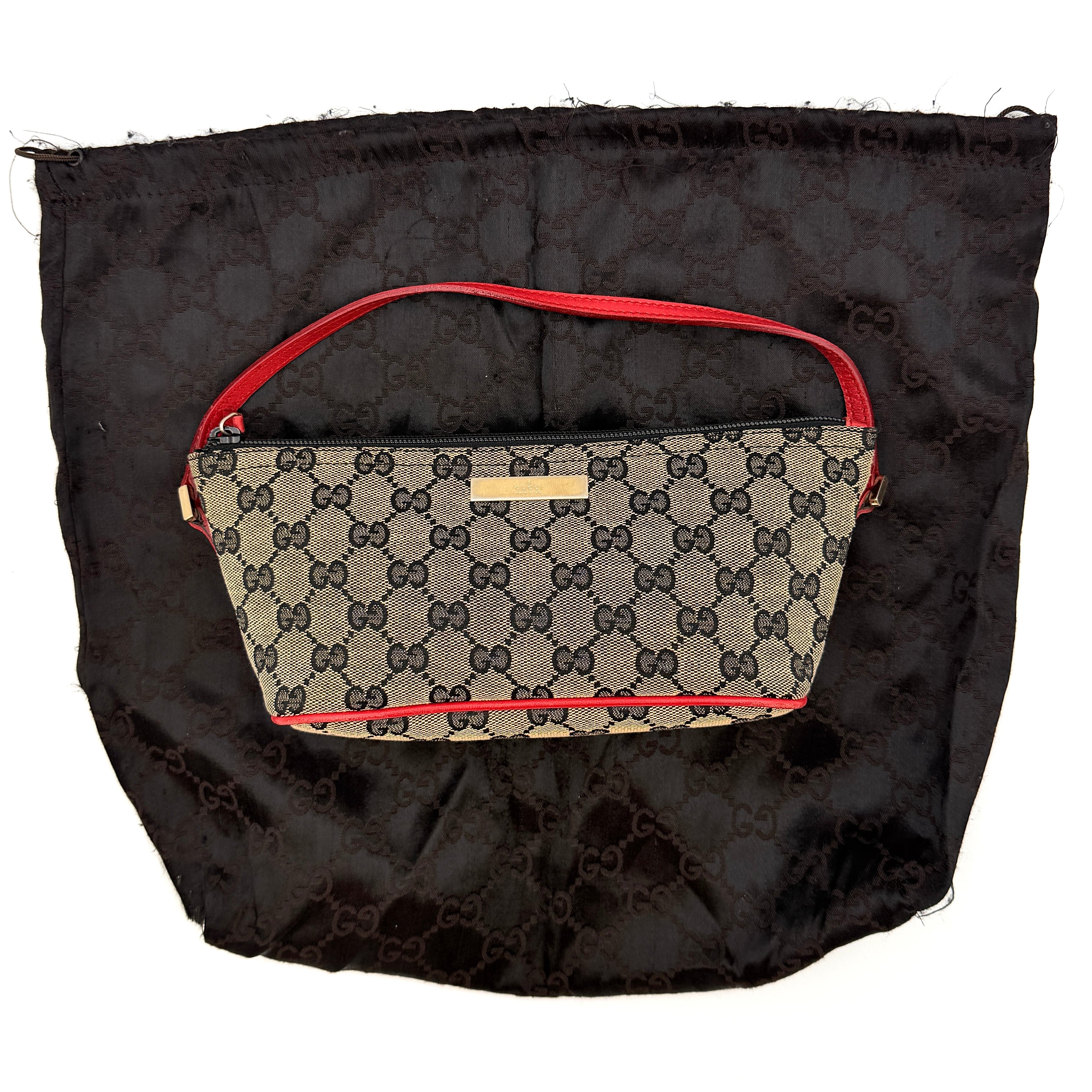 Gucci GG Monogram Pochette Boat Shoulder Bag in grey canvas with red leather trim and gold plaque, shown against a plain background.
