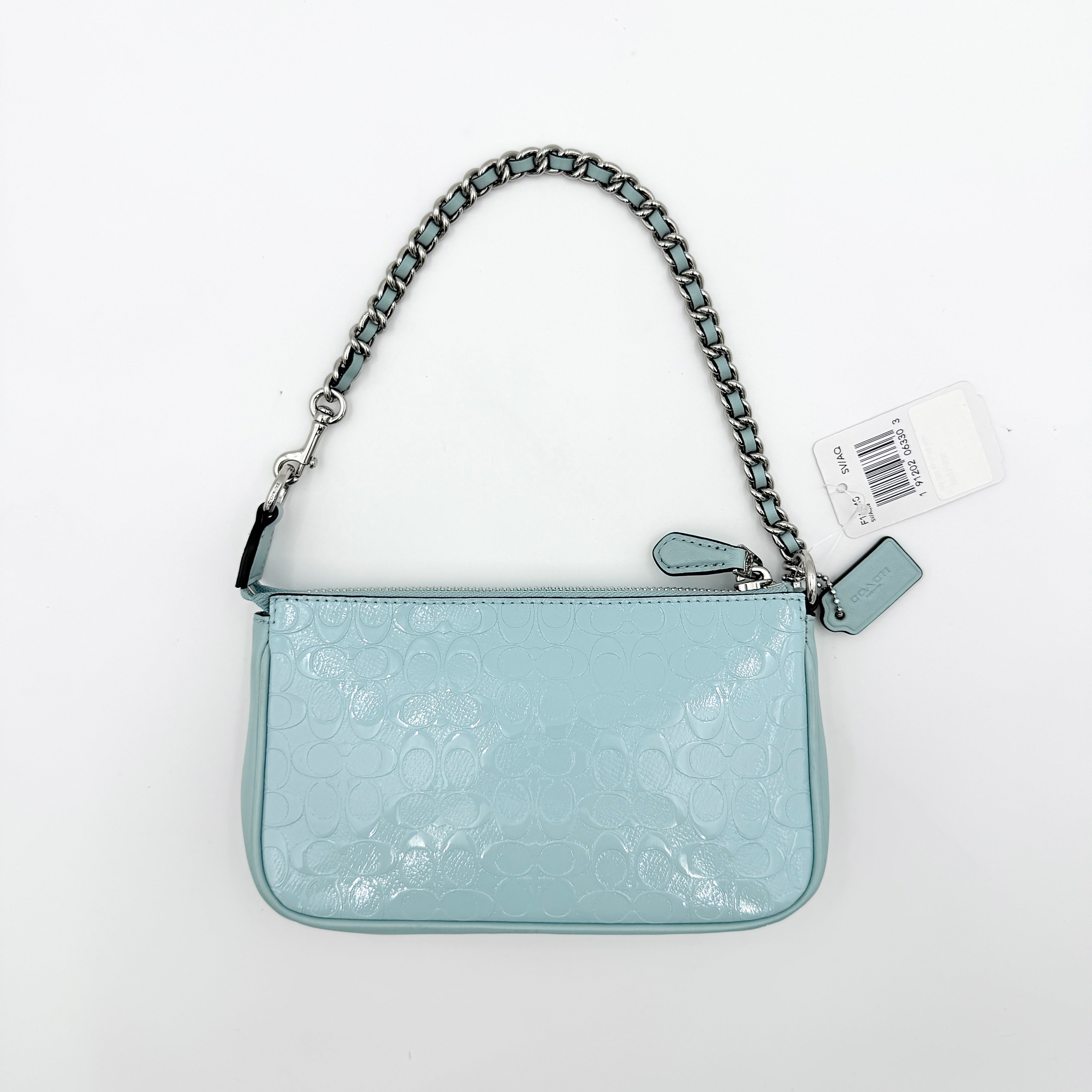 Coach Nolita 19 small shoulder bag in light blue embossed patent leather with silver-tone chain strap shown against a white background.