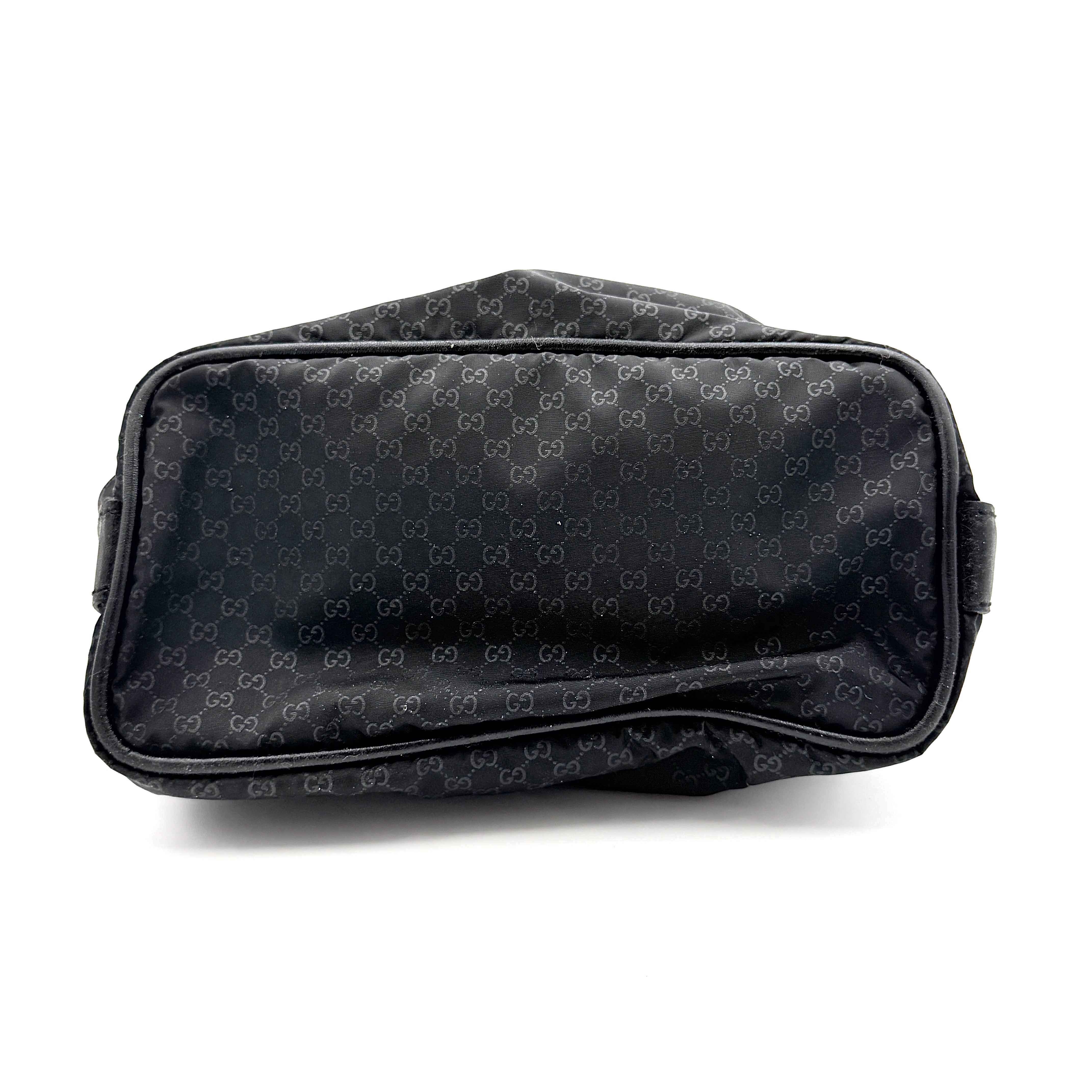 Gucci GG Monogram Mini Hobo black nylon shoulder bag with leather trim and silver-tone hardware, displayed on a plain background.