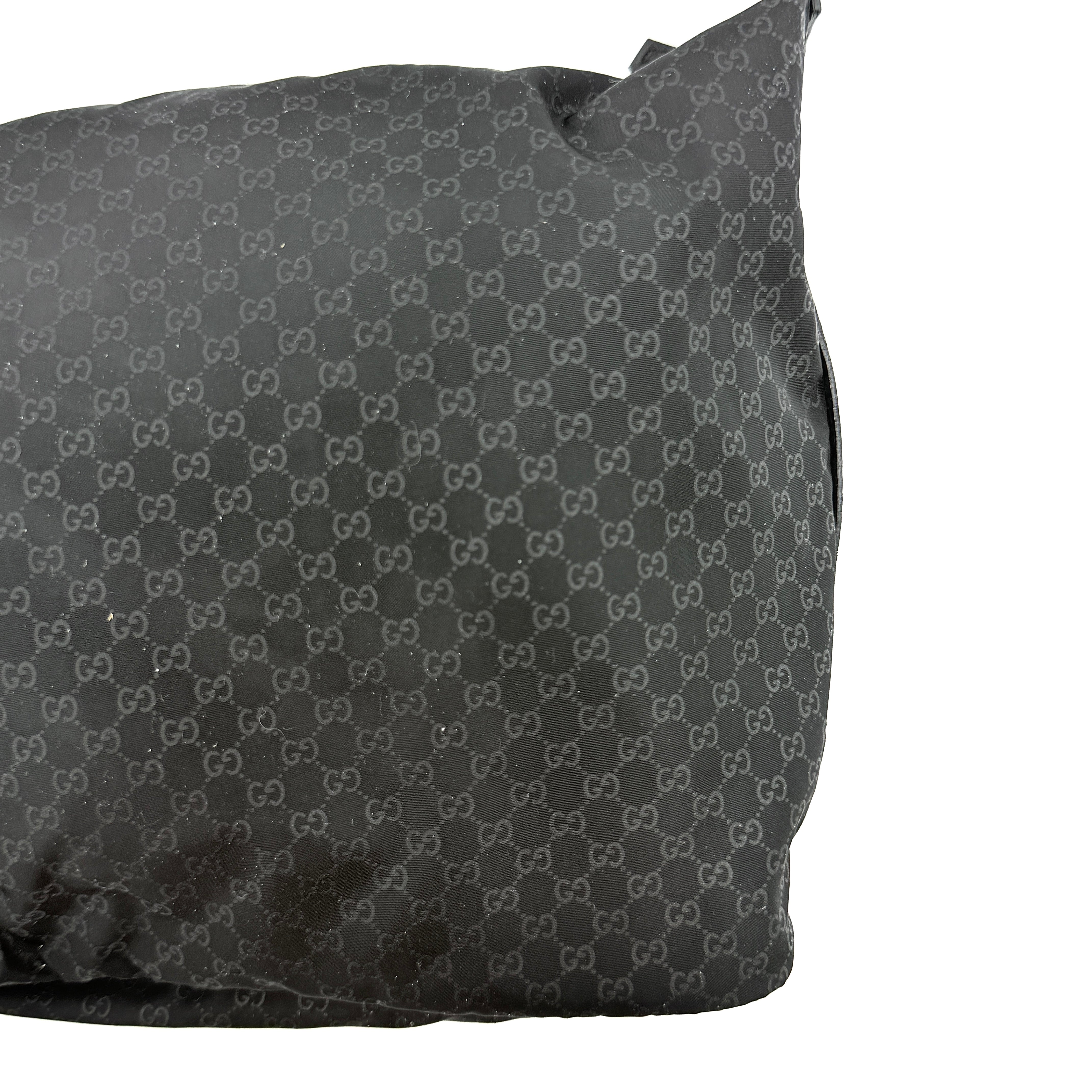 Gucci GG Monogram Mini Hobo black nylon shoulder bag with leather trim and silver-tone hardware, displayed on a plain background.