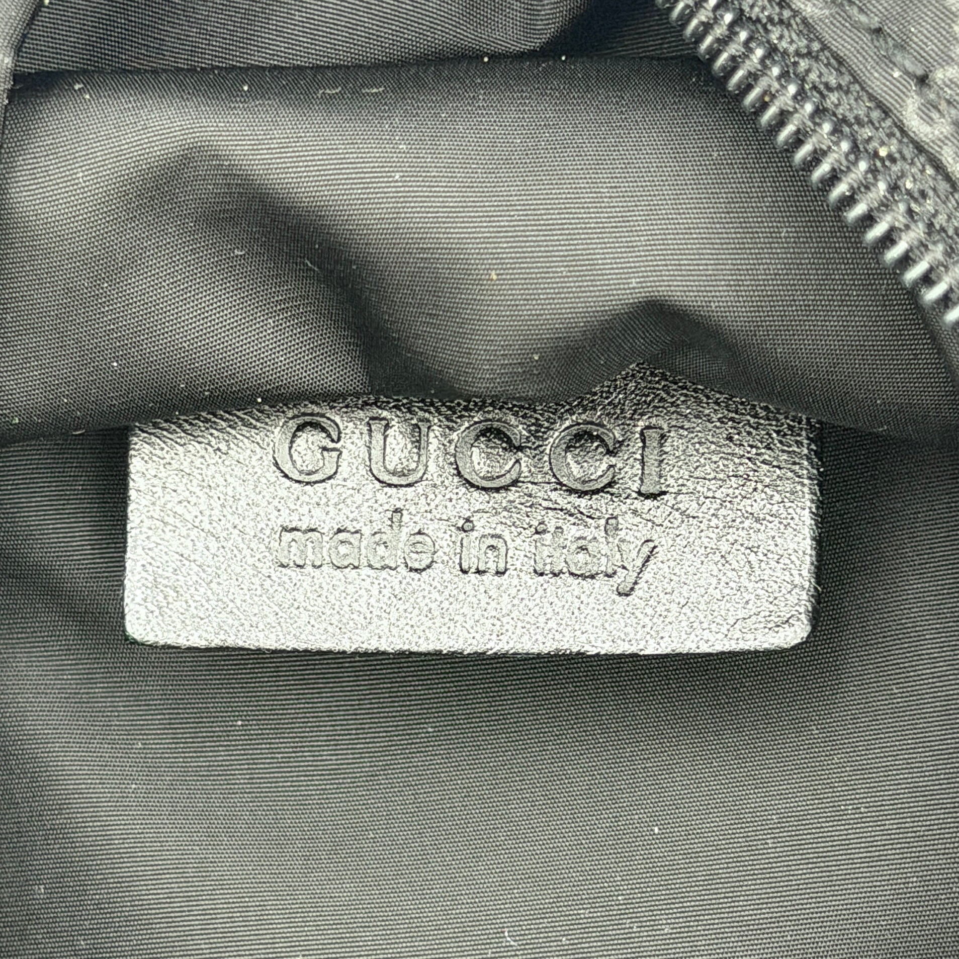 Gucci GG Monogram Mini Hobo black nylon shoulder bag with leather trim and silver-tone hardware, displayed on a plain background.