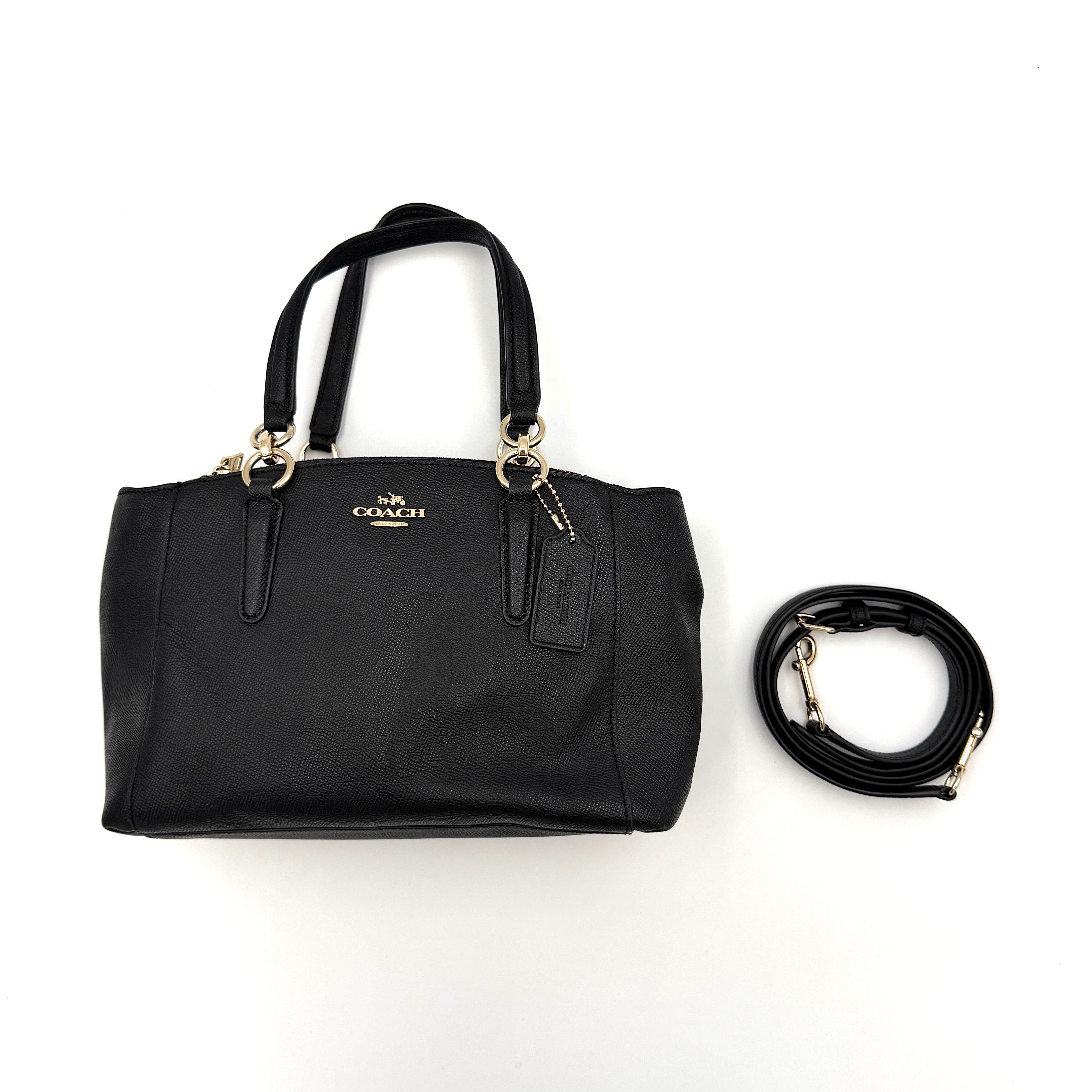 Coach 2Way Christie Carryall Handbag in black leather with gold hardware, detachable strap displayed alongside.