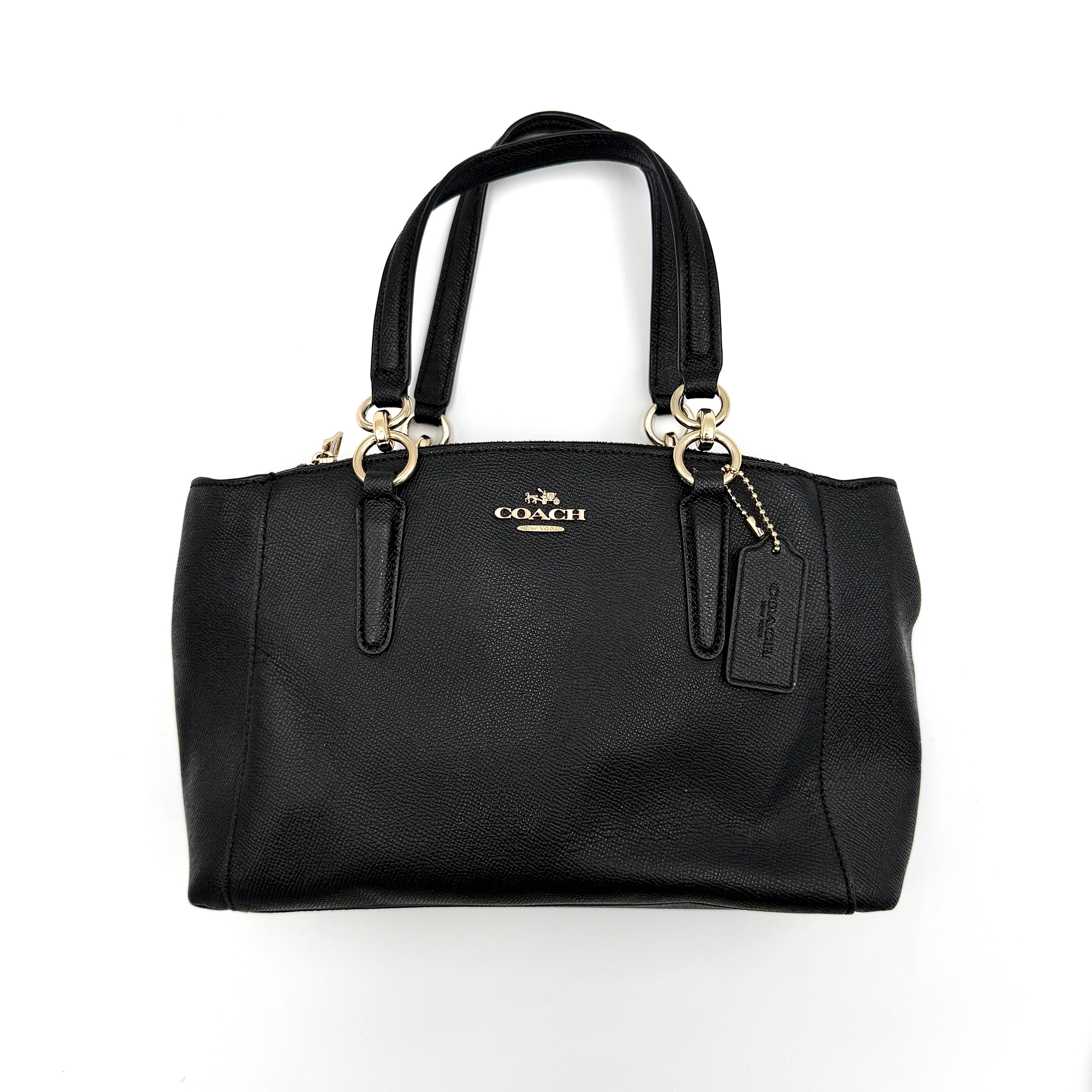 Coach 2Way Christie Carryall Handbag in black leather with gold hardware, detachable strap displayed alongside.