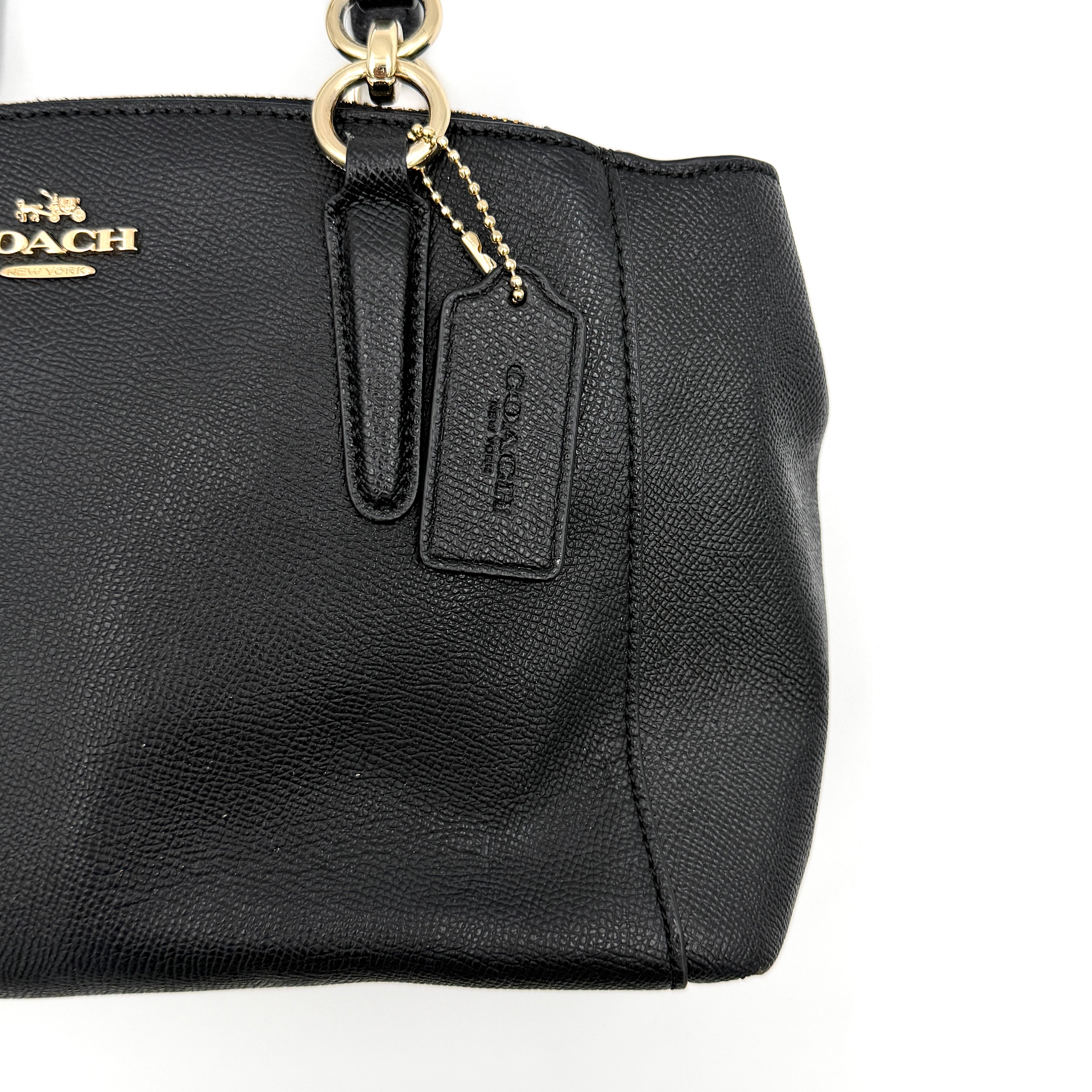 Coach 2Way Christie Carryall Handbag in black leather with gold hardware, detachable strap displayed alongside.