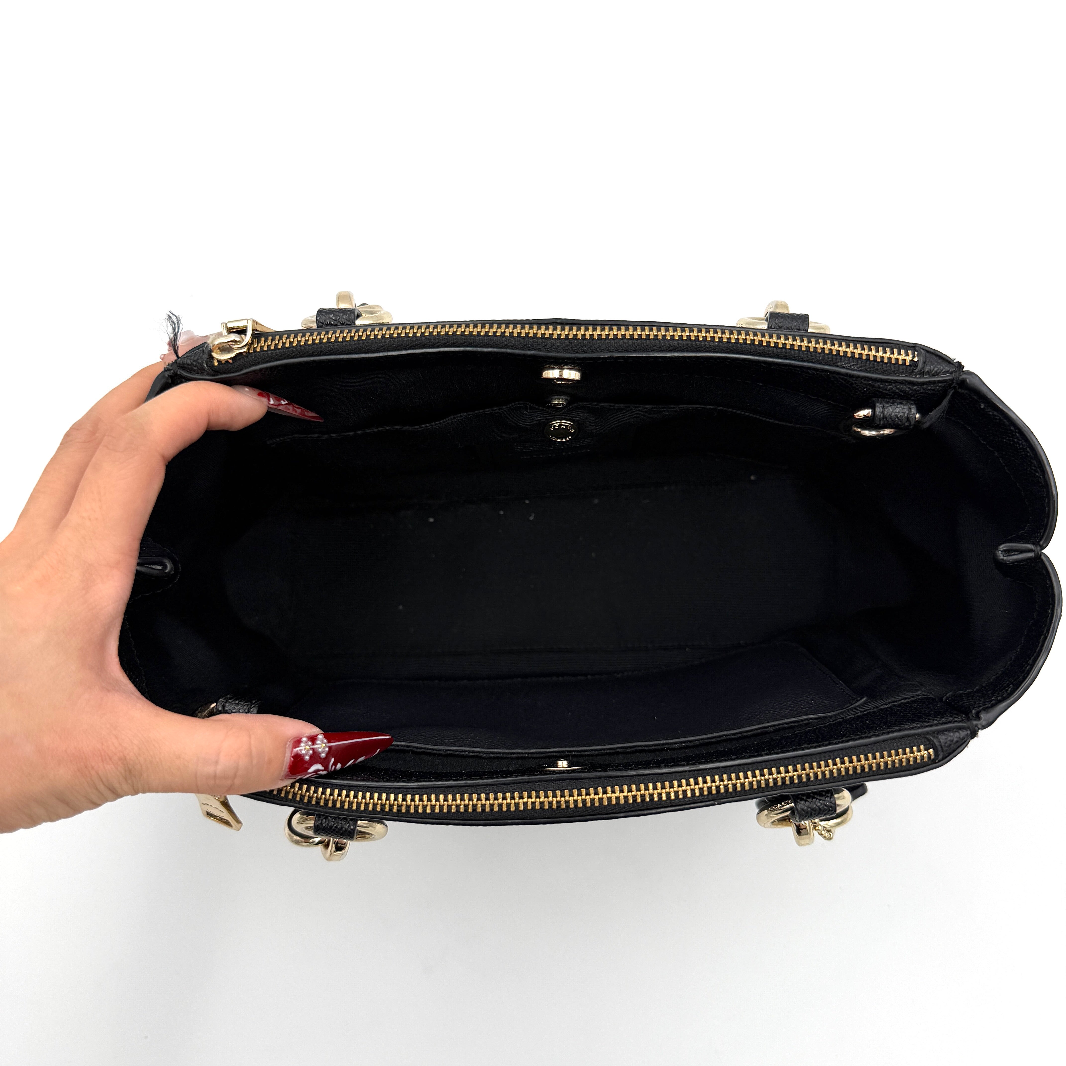 Coach 2Way Christie Carryall Handbag in black leather with gold hardware, detachable strap displayed alongside.