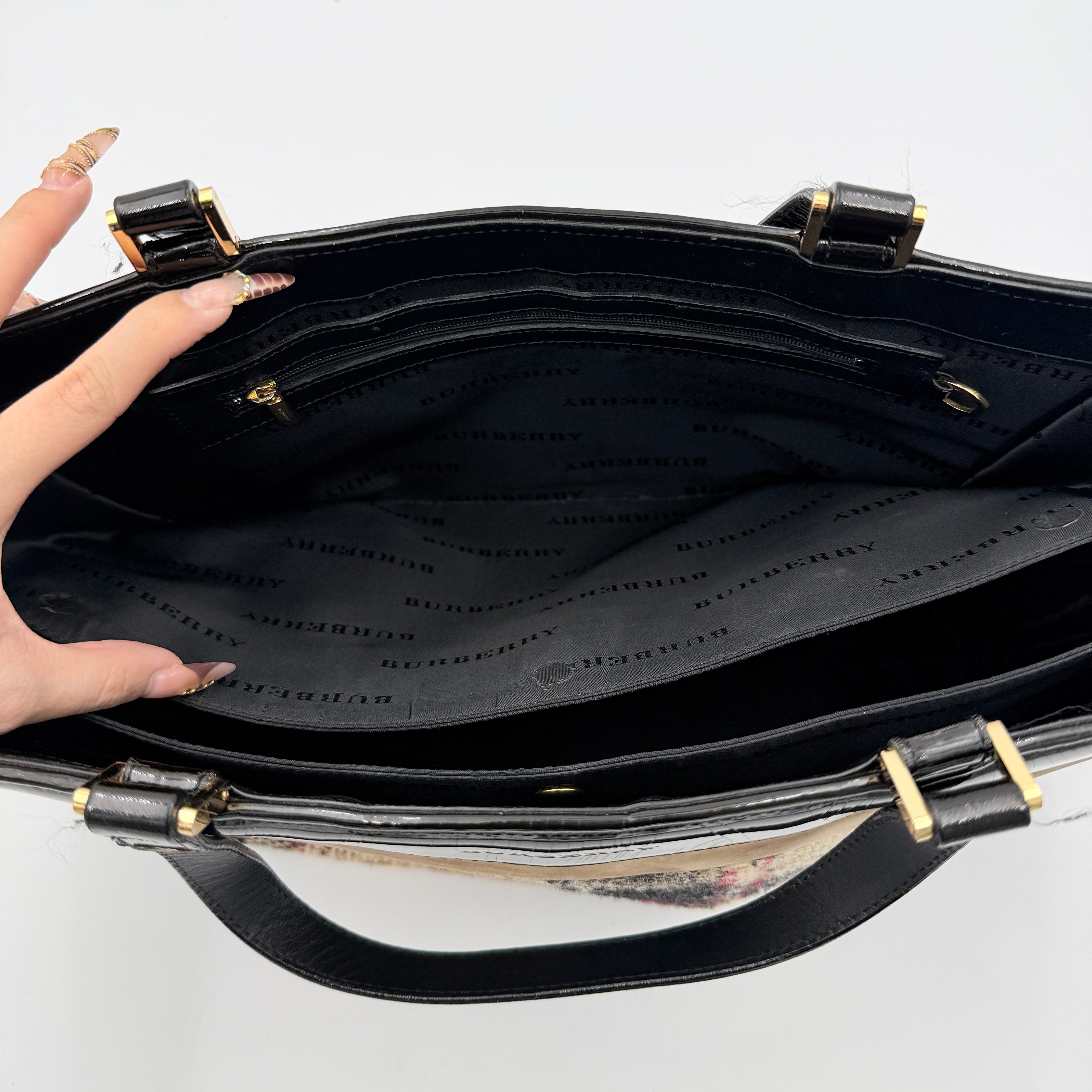 Burberry Nova Check Wool Shoulder Bag in beige and black wool with patent leather trim and double handles.