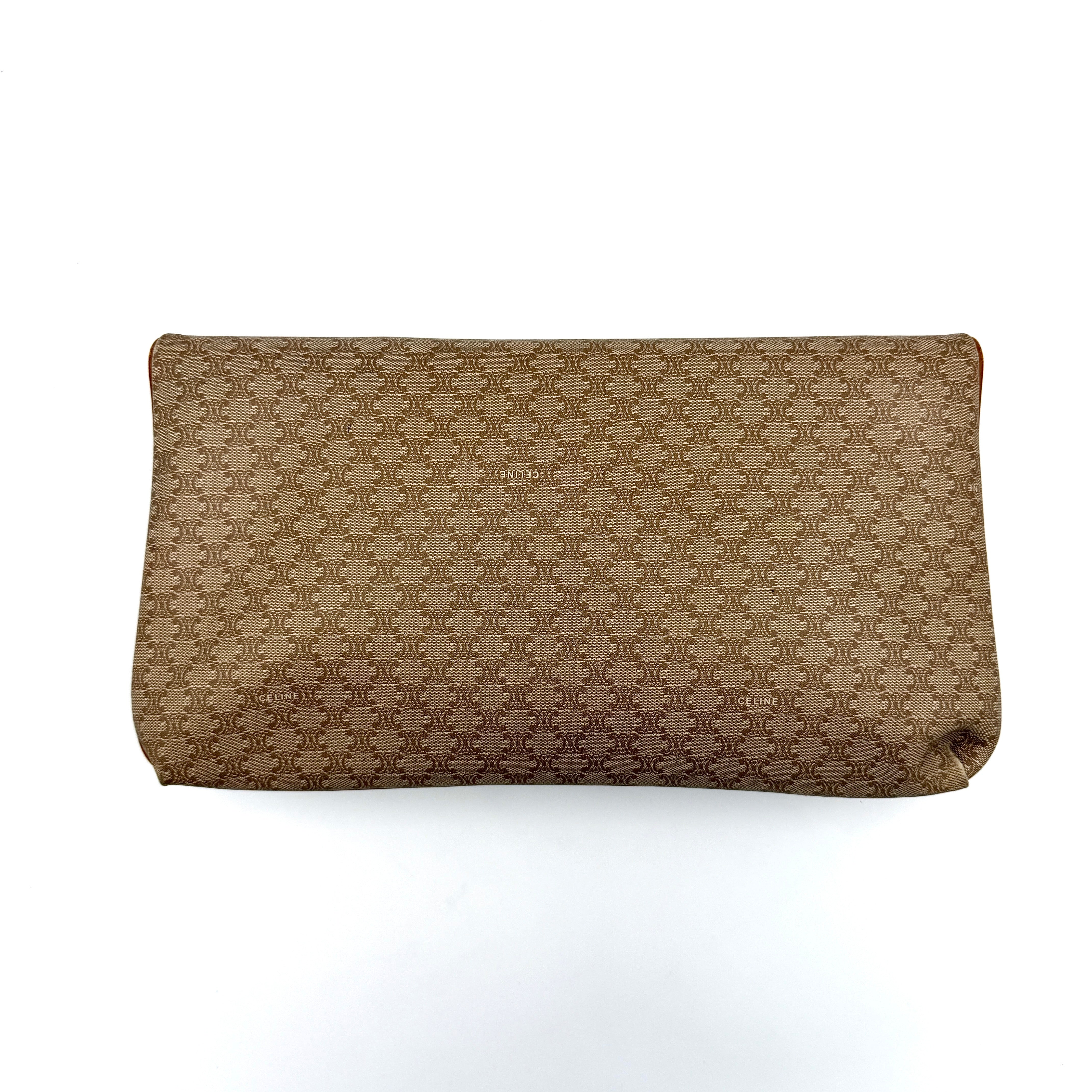 The Celine Macadam Clutch Bag in beige, featuring the iconic monogram canvas and tan leather trim, shown neatly closed with its signature emblem on the flap.